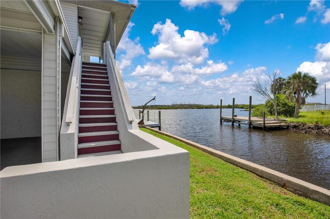 Exterior staircase leads to the upstairs porch & entrance to home - 12396 W Standish DR, HOMOSASSA FL 34448, Homosassa