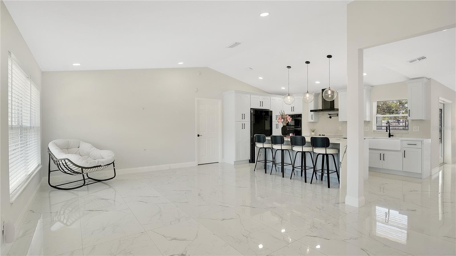 Living and dining area open to the kitchen - 2685 GROVELAND AVE, DELTONA