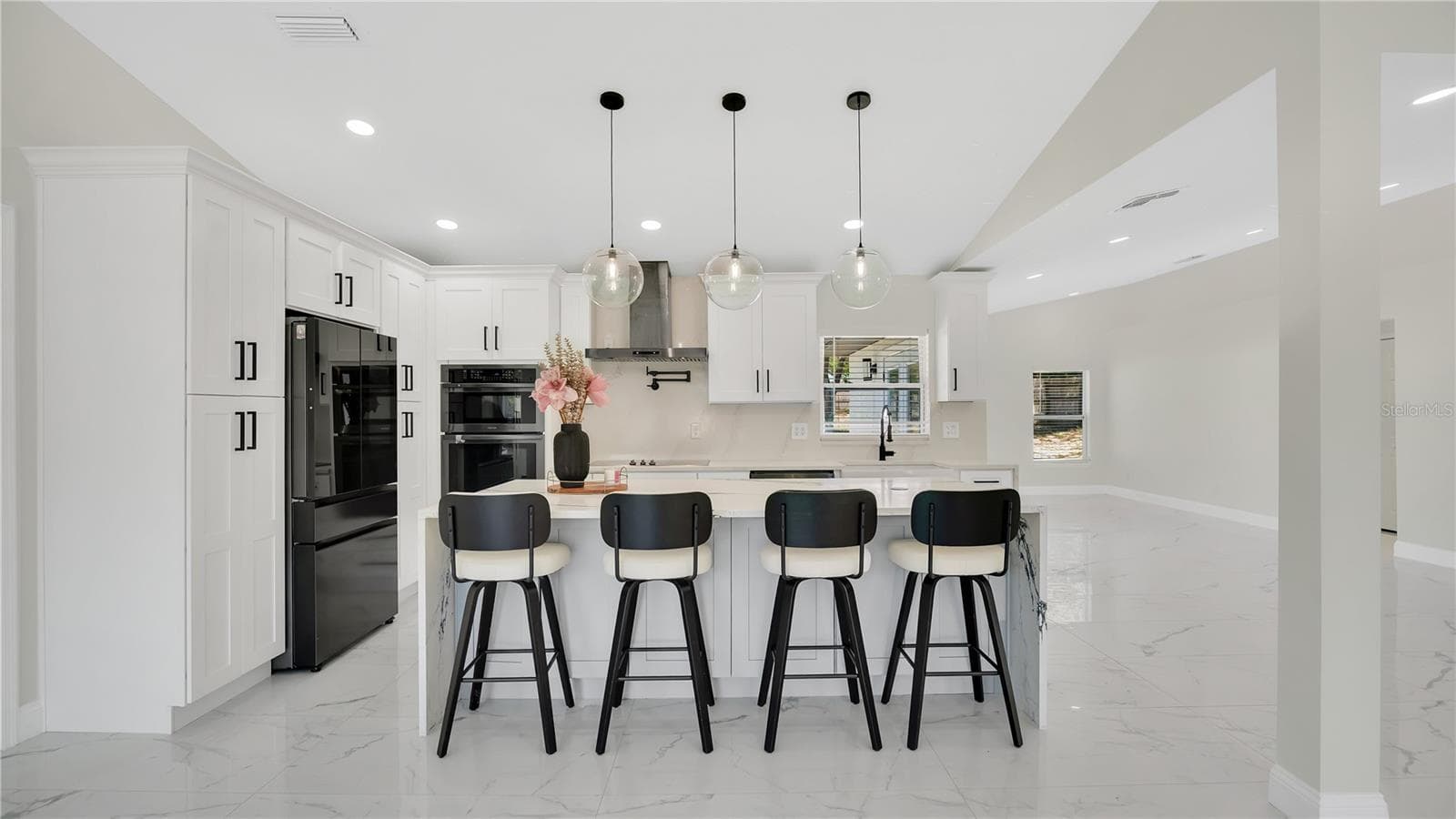 Kitchen island and bar seating - 2685 GROVELAND AVE, DELTONA