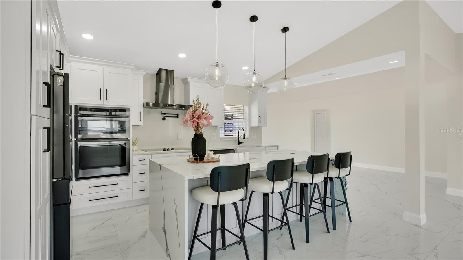 Kitchen with built-in oven and range hood - 2685 GROVELAND AVE, DELTONA