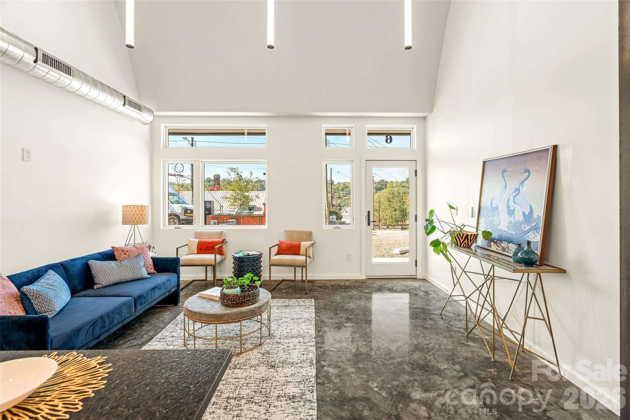 Heated and polished concrete floors on level one. - 6 Roberts Street, Asheville