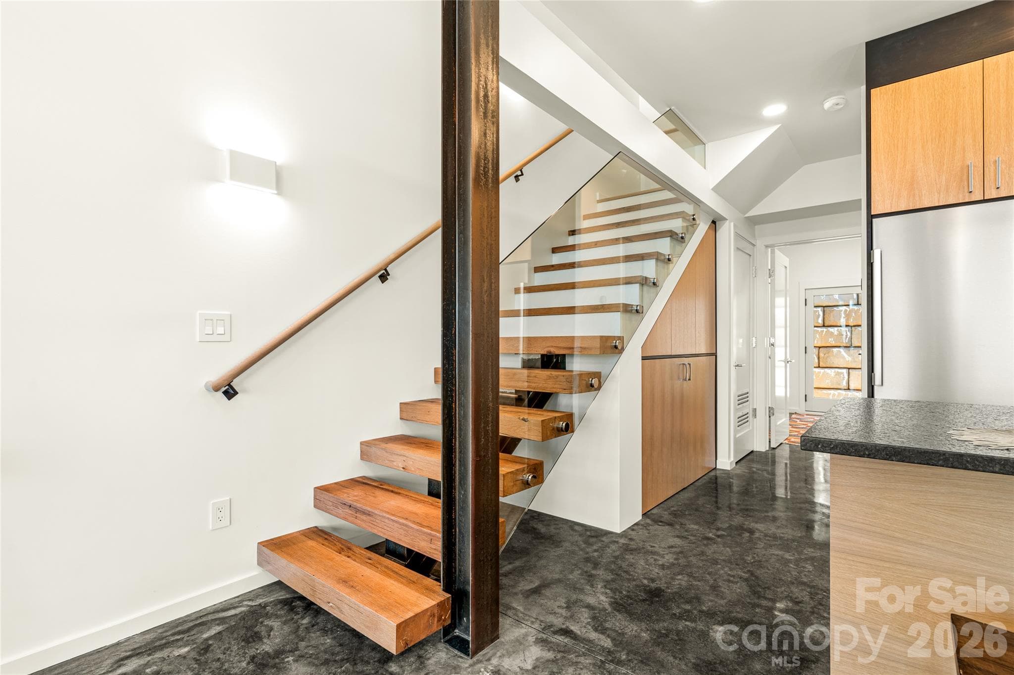 The industrial design features steel, glass and locally milled, reclaimed barnwood stairs. - 6 Roberts Street, Asheville