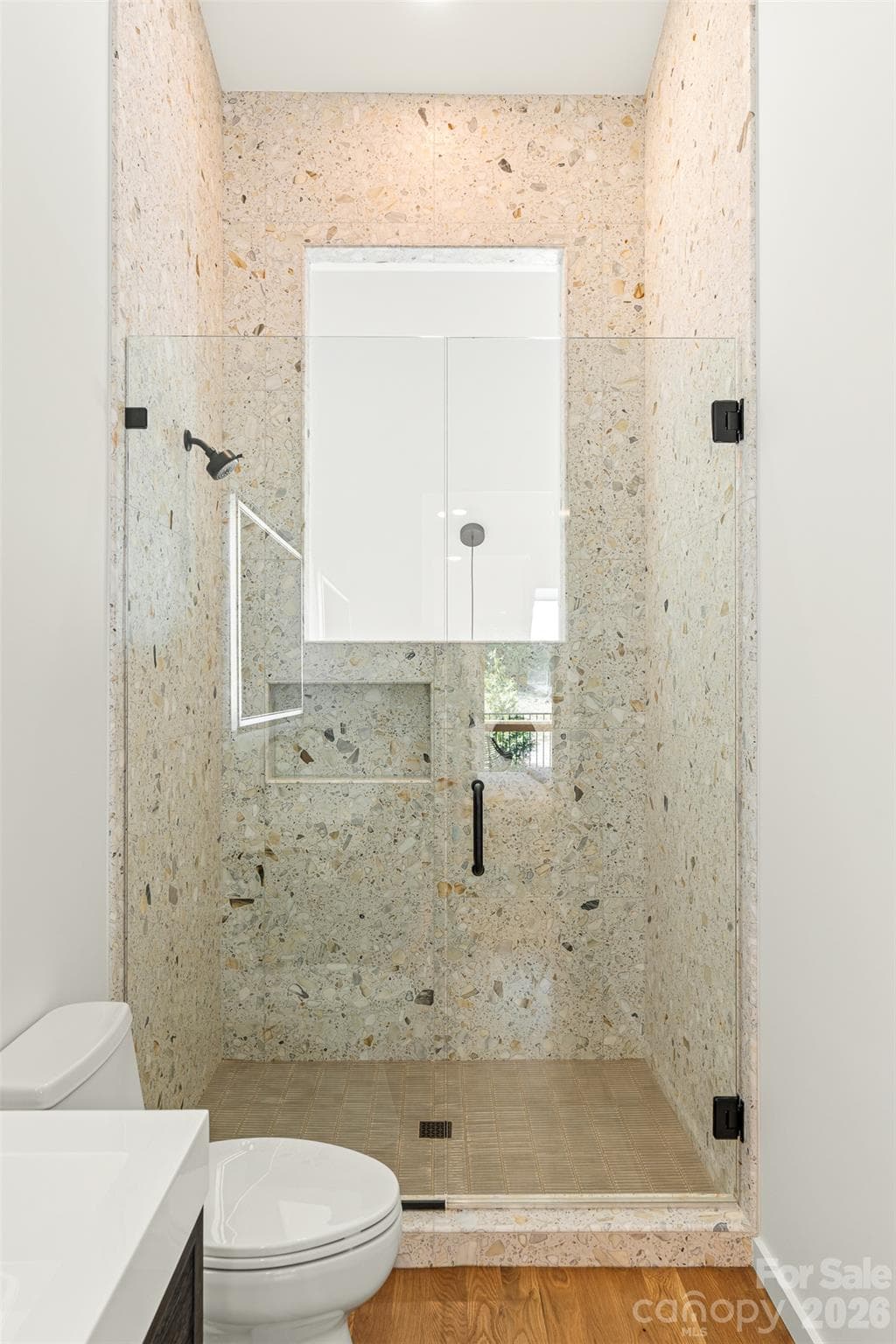 Primary shower with floor to ceiling terrazzo tile. - 6 Roberts Street, Asheville