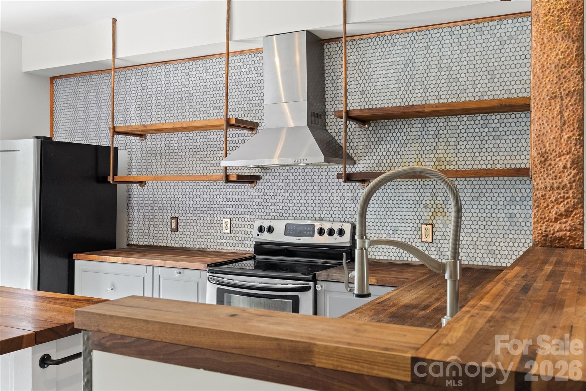 Modern range hood with stainless appliances - 3564 N Davidson Street, Charlotte