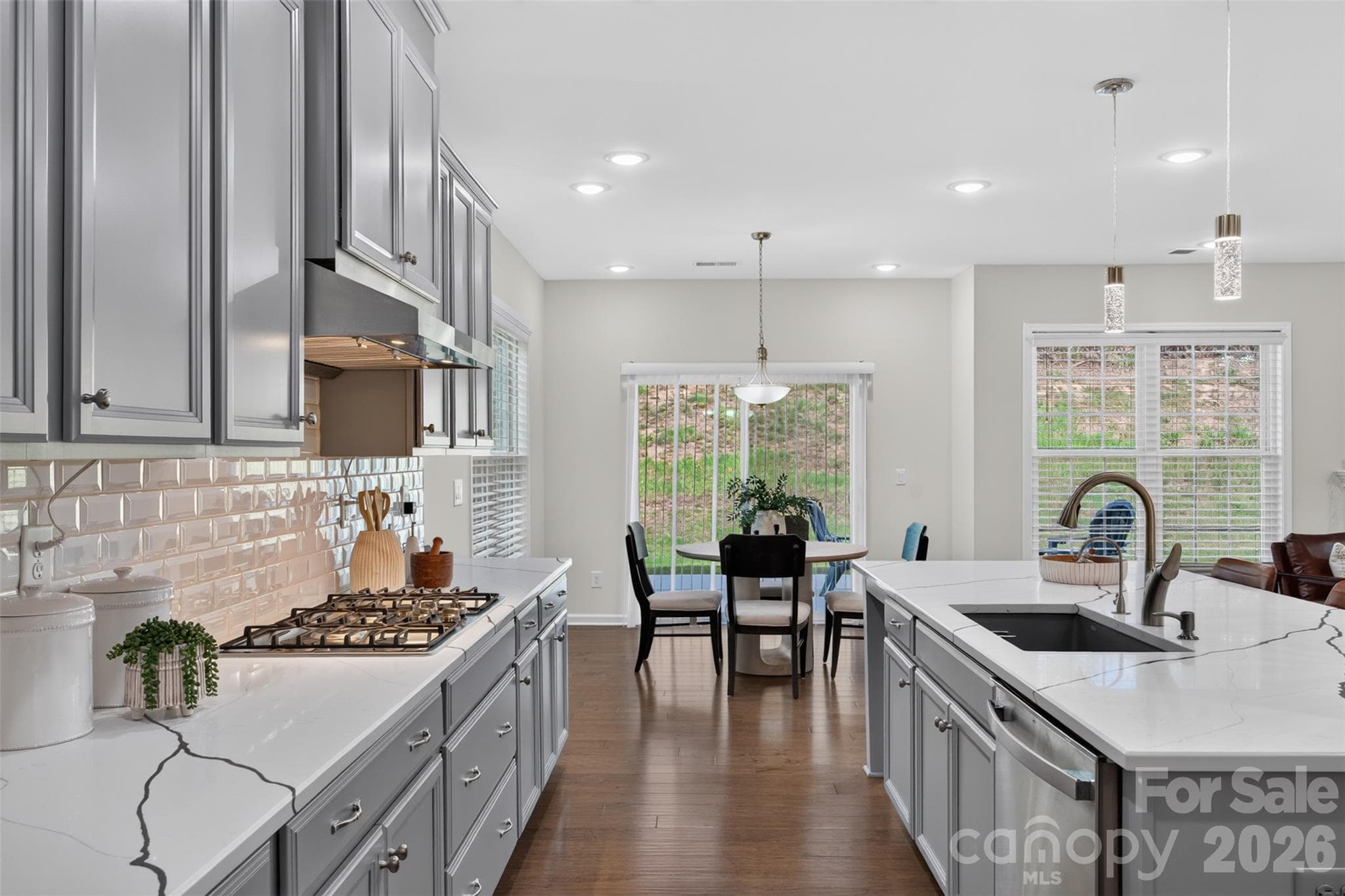 Beautiful, functional, modern kitchen with large center island, vented gas cooktop, breakfast area. - 4638 Monument Valley Drive, Indian Land