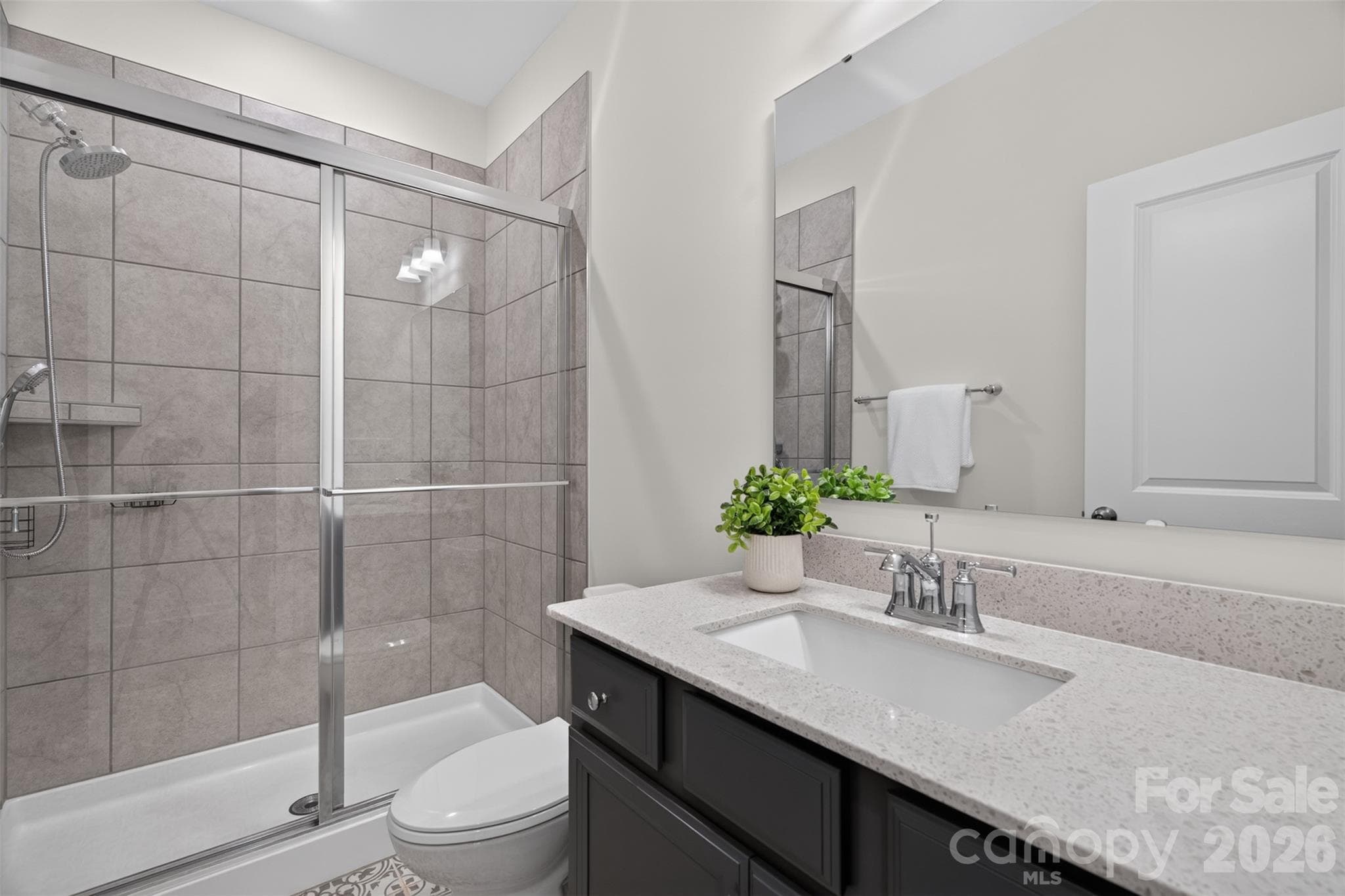 First floor full bathroom with decorative tile floor and walk-in shower. - 4638 Monument Valley Drive, Indian Land