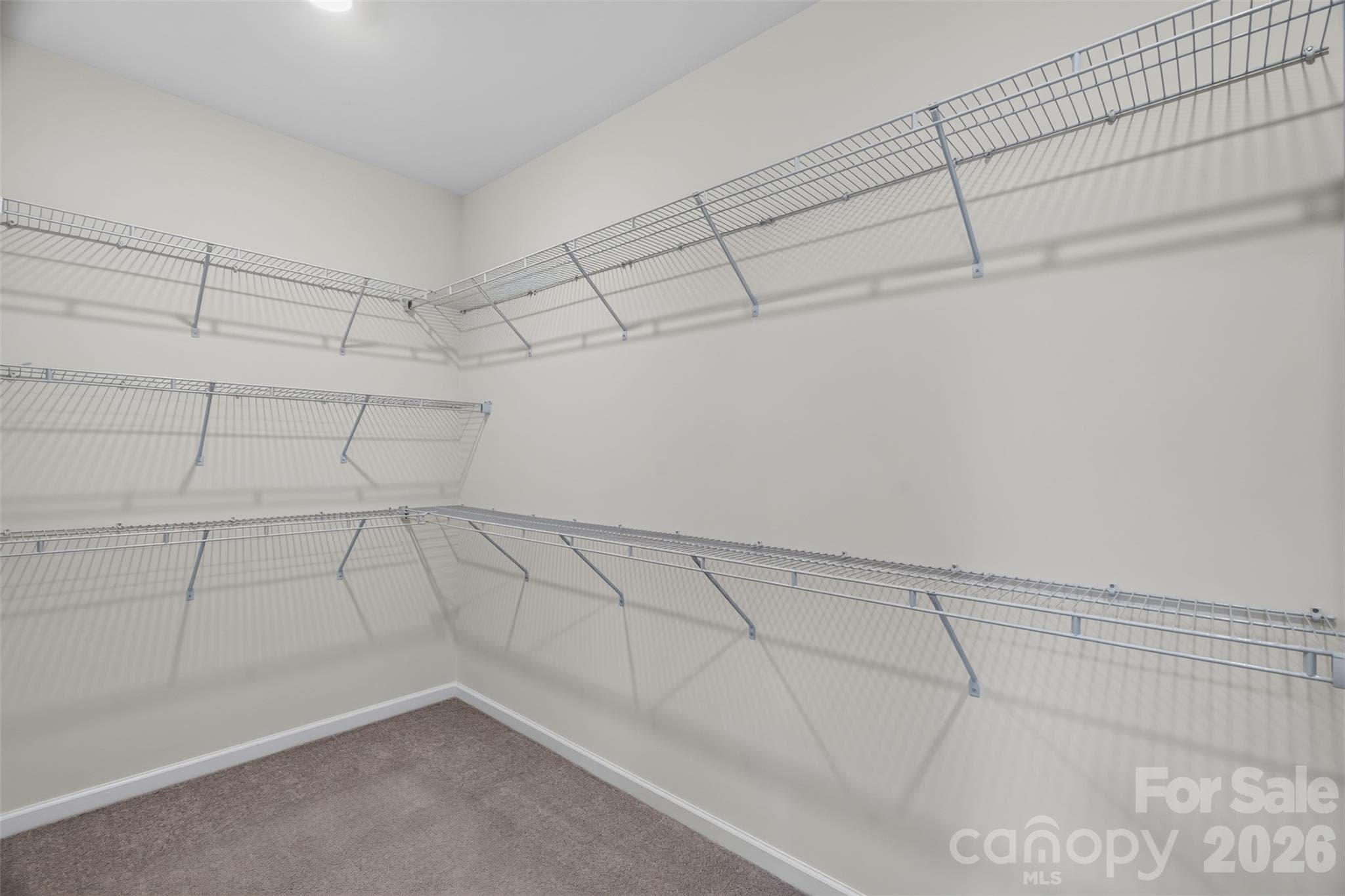 Large primary bedroom closet for ample storage. - 4638 Monument Valley Drive, Indian Land