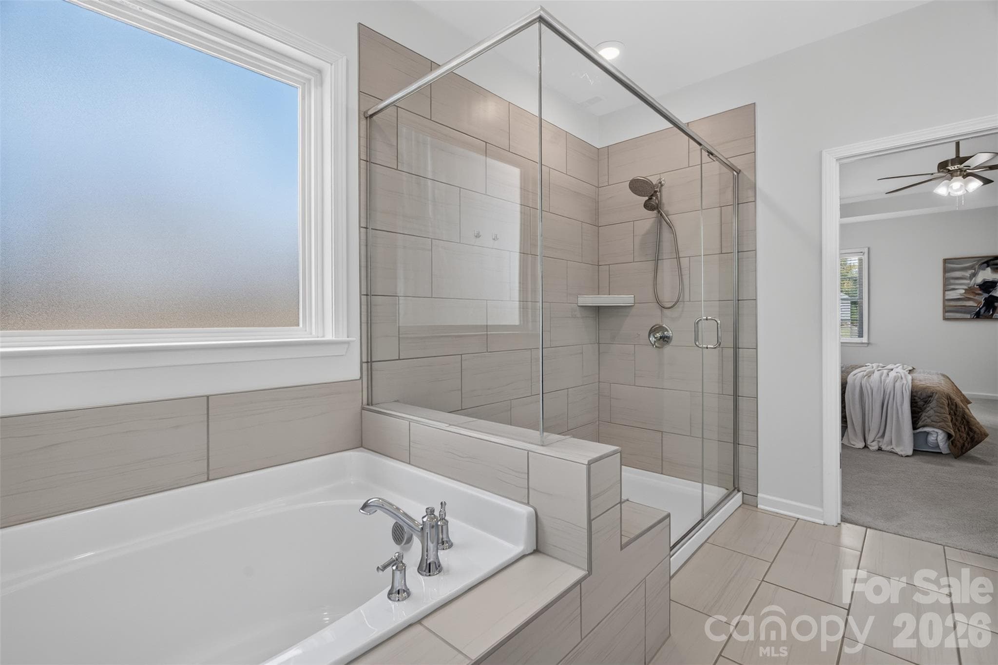 Primary bathroom with garden tub and walk-in shower. - 4638 Monument Valley Drive, Indian Land