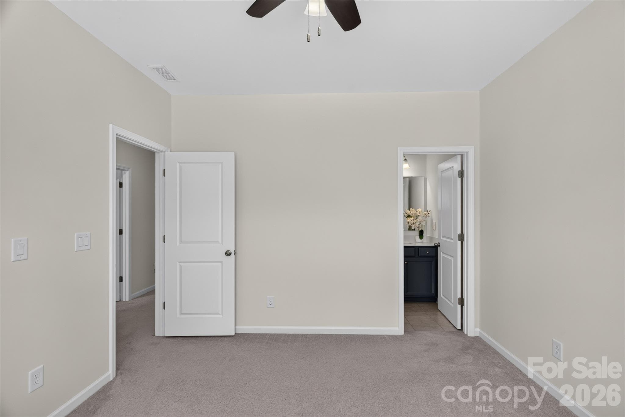 Fifth bedroom with private bathroom and walk-in closet with a window. - 4638 Monument Valley Drive, Indian Land