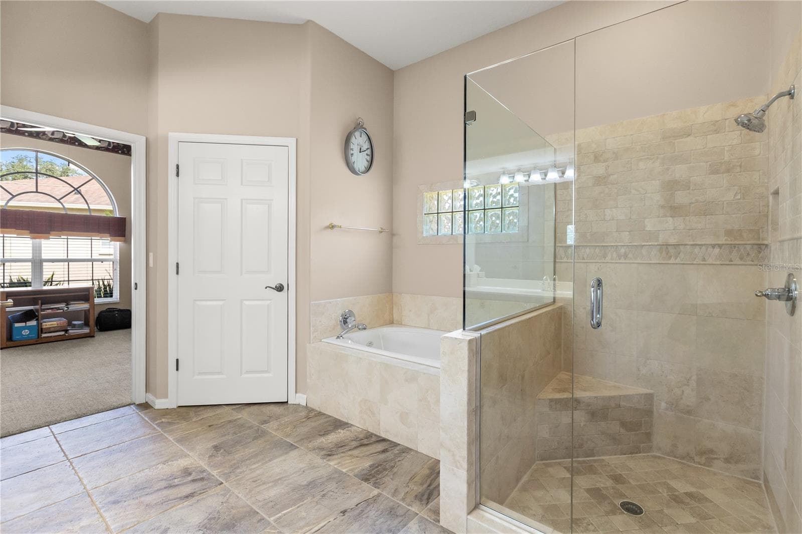 Primary bathroom featuring double vanity sinks, soak in tub and shower - 2735 TETON STONE RUN, ORLANDO