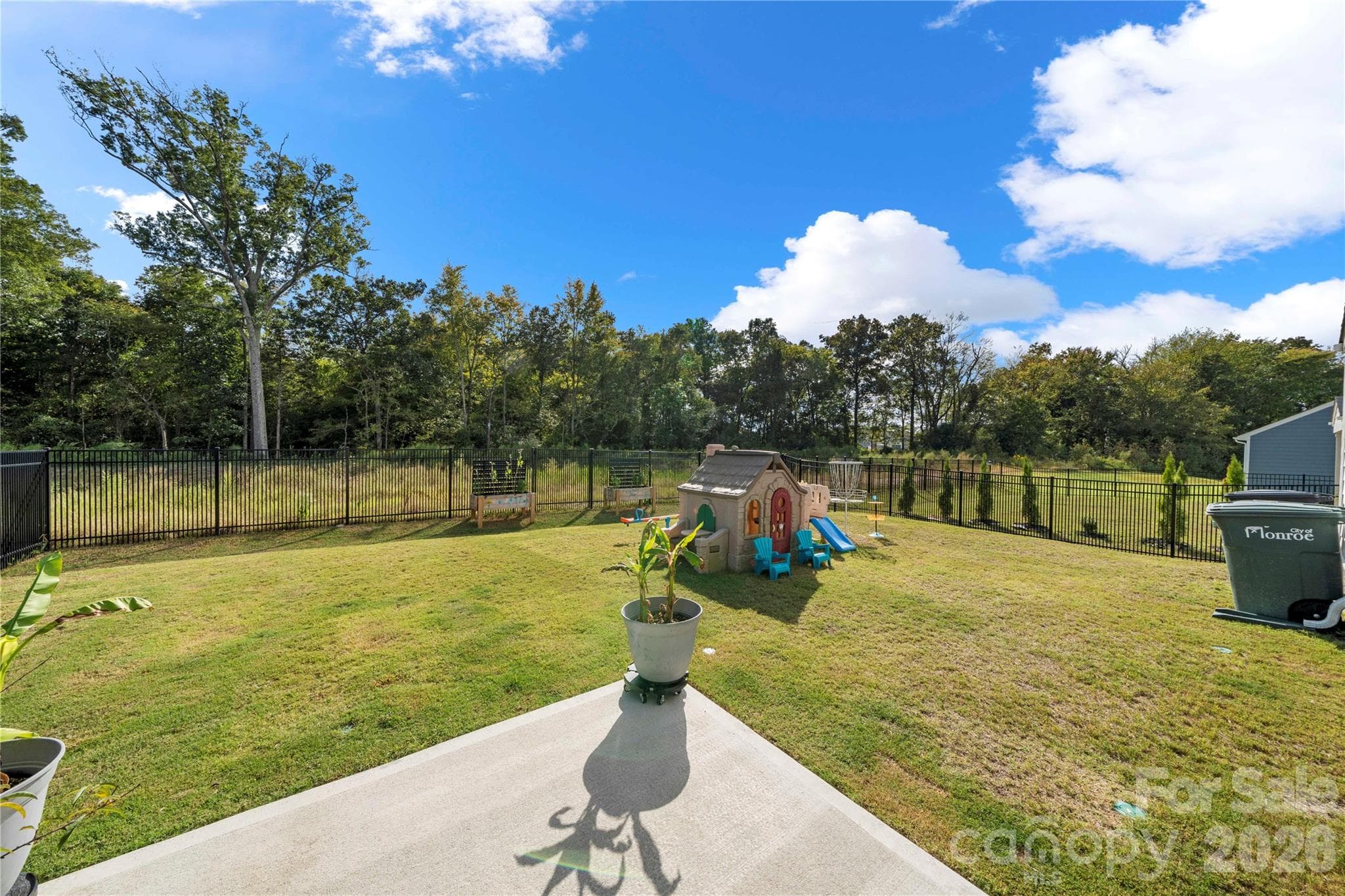 Beautiful fenced in backyard that faces a dry pond/woods! - 3838 Pee Dee Street, Monroe