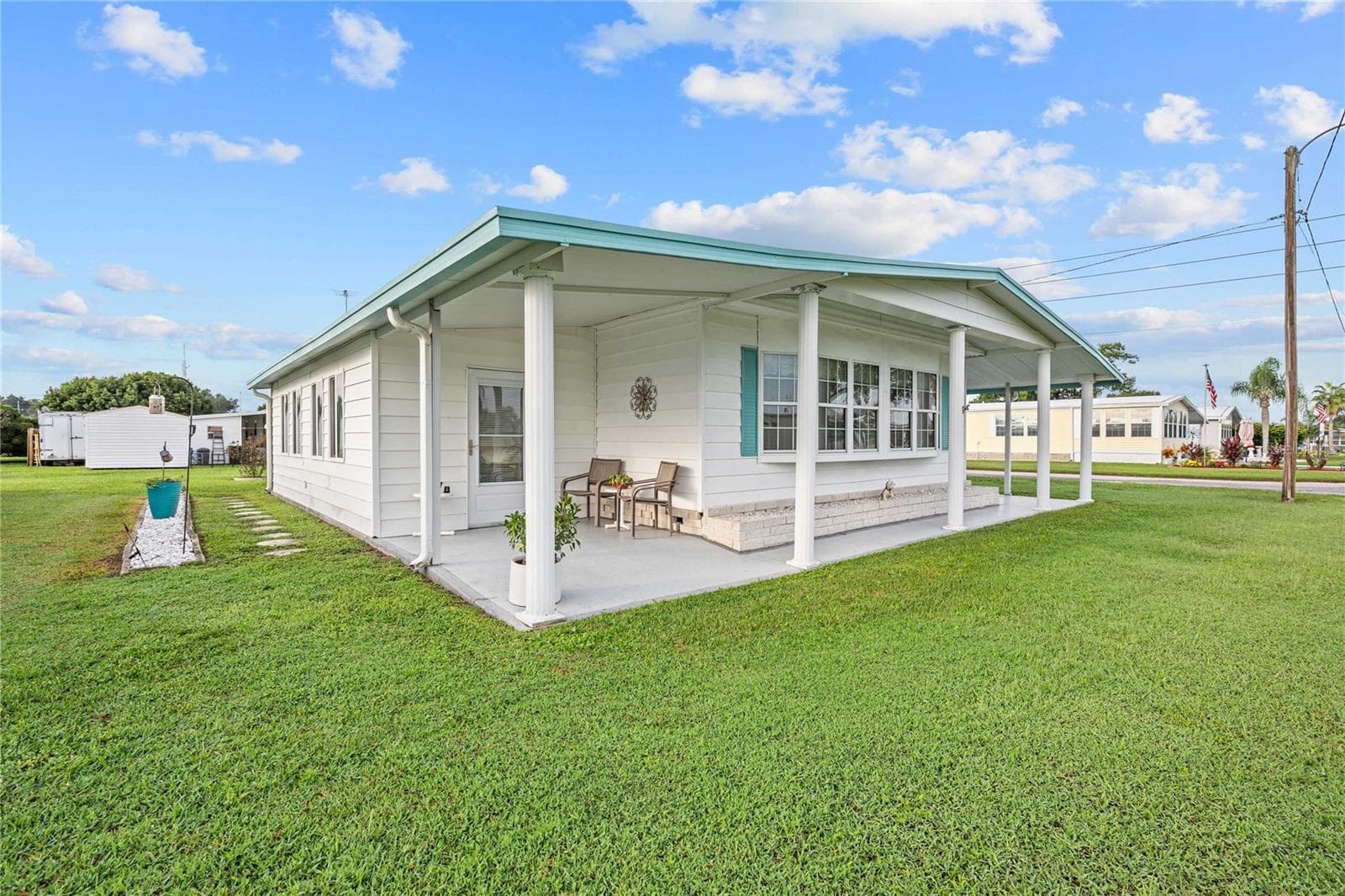 Nice front covered porch. - 5352 PLANT ST, ZEPHYRHILLS