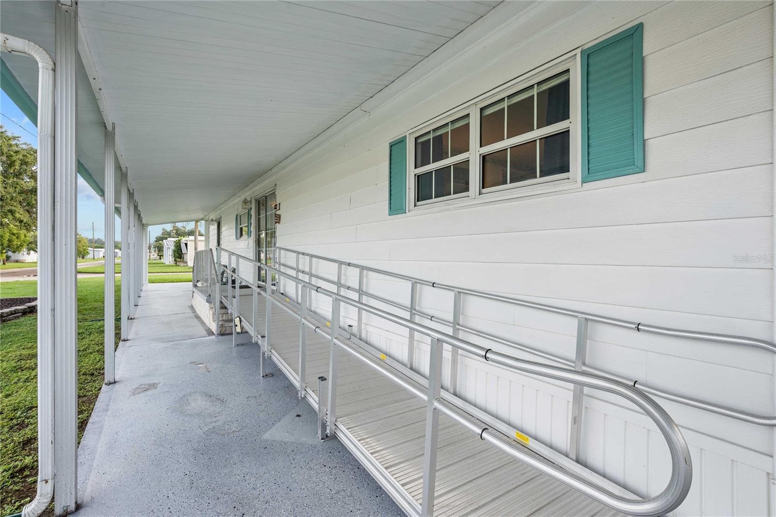 Entry has ramp that can be removed. - 5352 PLANT ST, ZEPHYRHILLS
