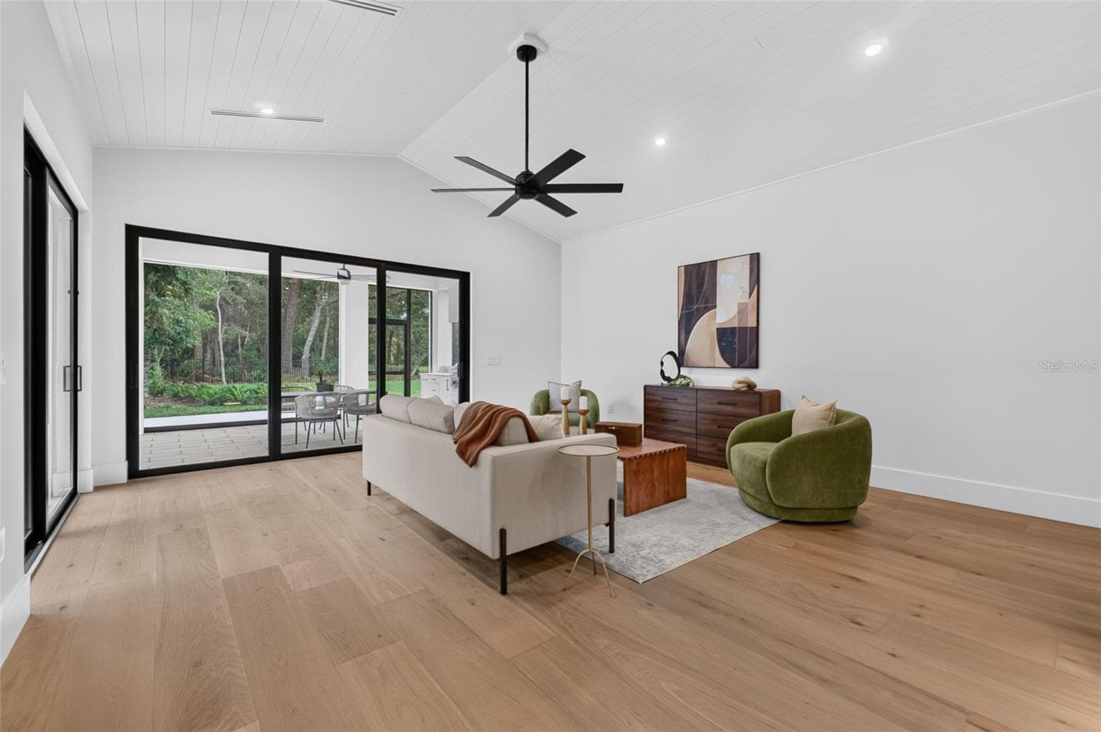 Game room features a wet bar with beverage refrigerator and two large sliding glass doors that provide direct access to pool and covered lanai - 1815 WINDERMERE RD, WINDERMERE