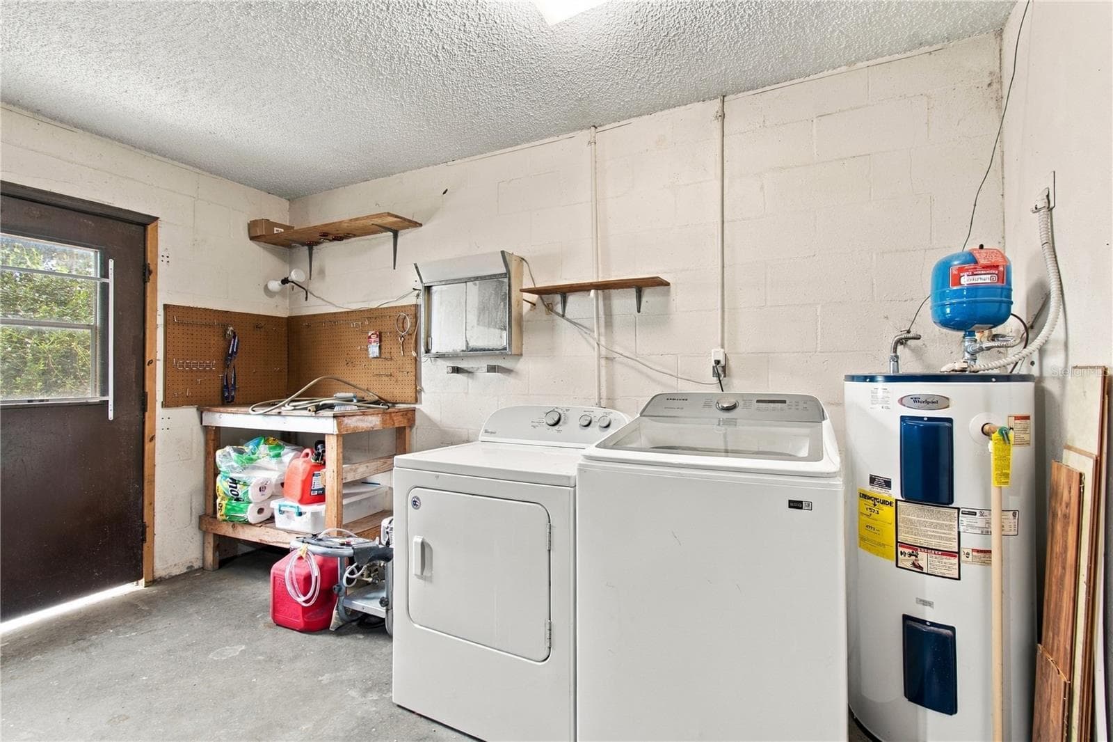 Washer, Dryer, and Water Heater are in the Garage - 8410 ANGELA CT, ZEPHYRHILLS
