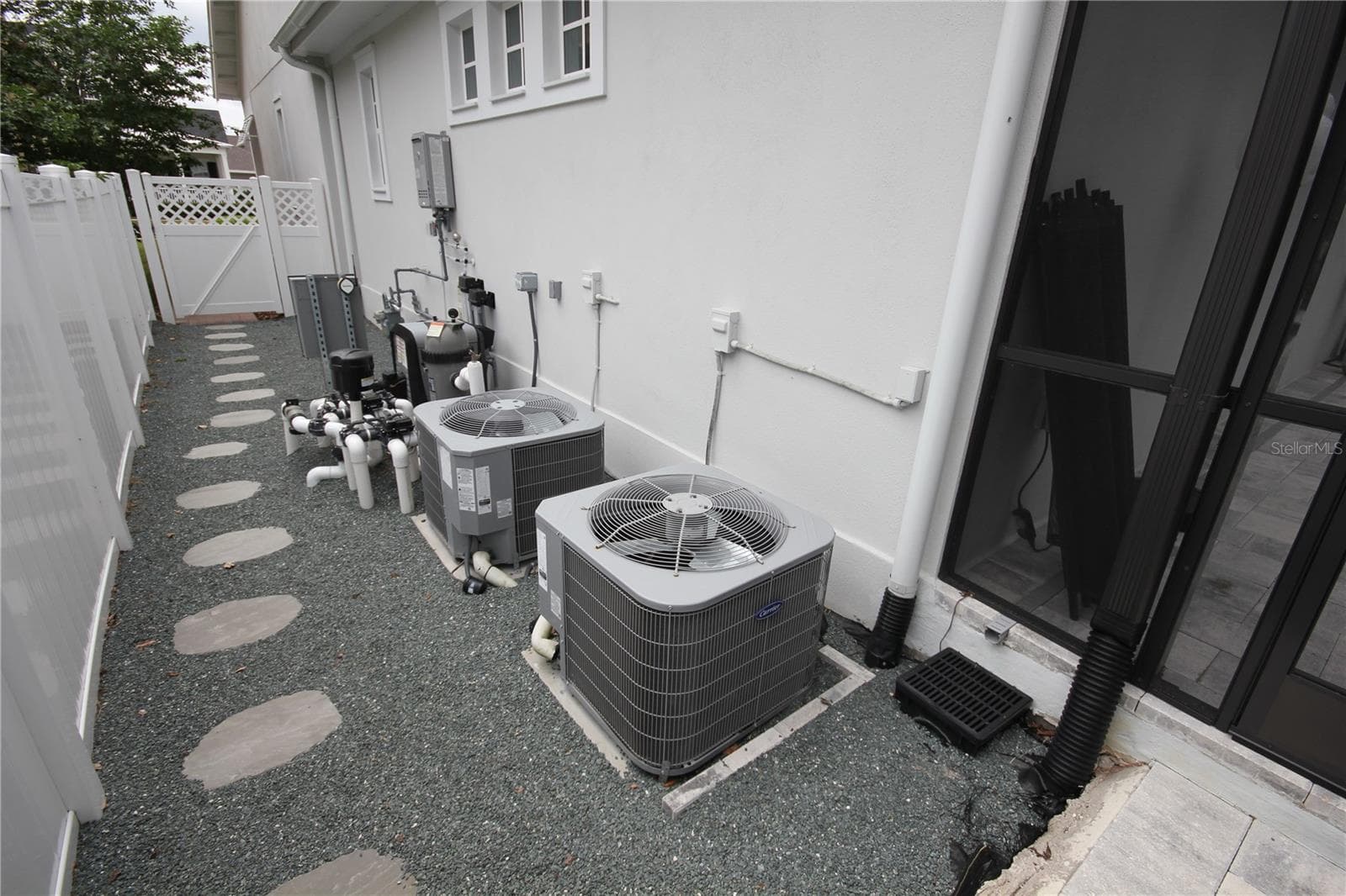 SINGLE AREA MECHANICAL EQUIPMENT WITH PRIVACY FENCING - 1859 BEACH RIDGE RD, CELEBRATION
