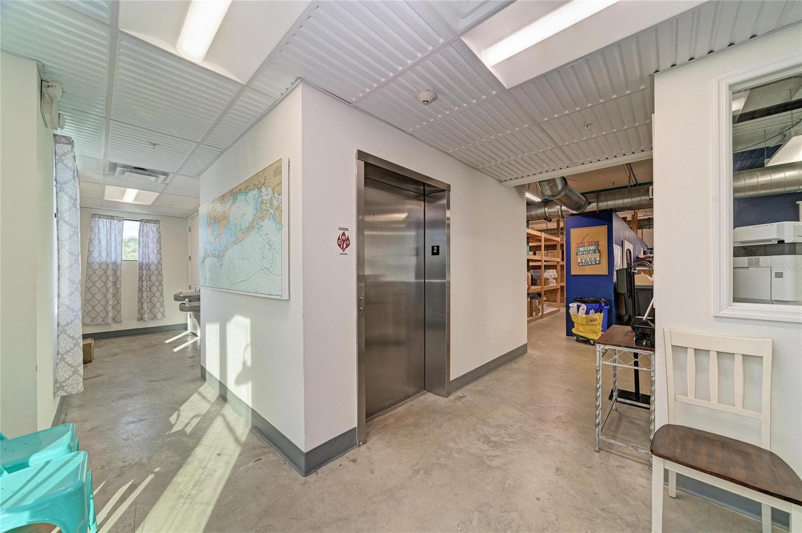 Lobby with bathrooms, egress and elevator - 3004 AVENUE C, HOLMES BEACH