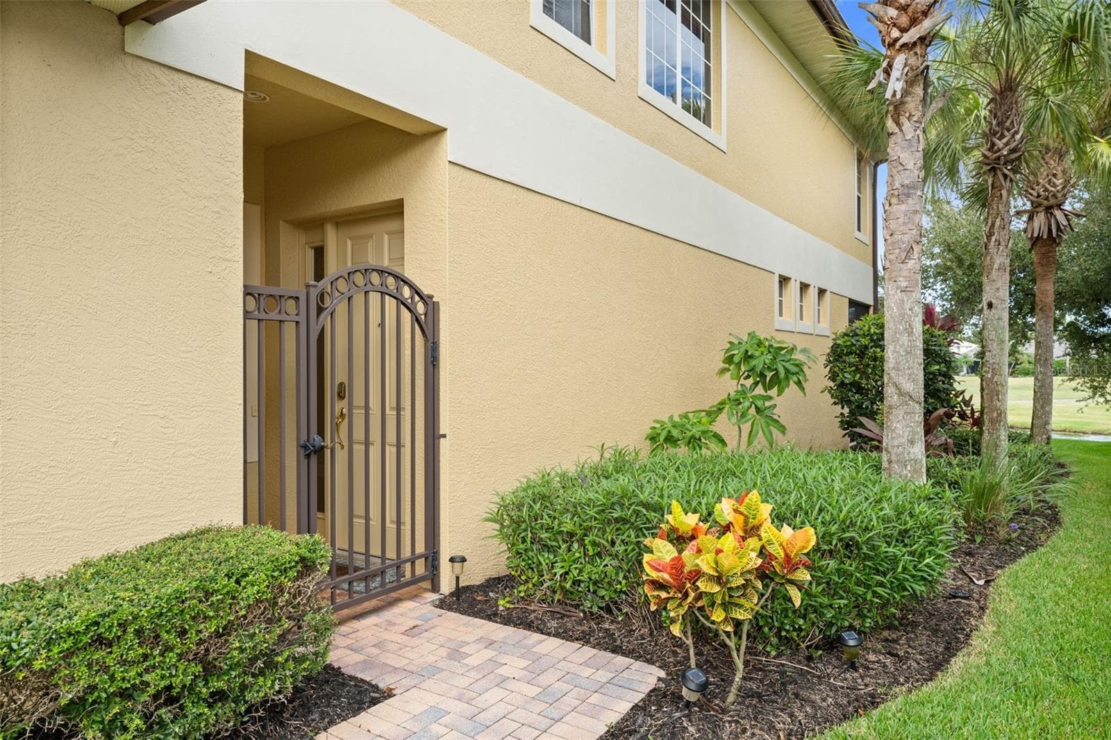 A tucked-away gated entrance adds privacy and a convenient spot for deliveries. - 8432 MIRAMAR WAY, LAKEWOOD RANCH