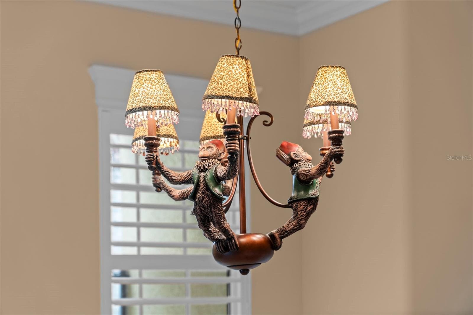 A distinctive chandelier brings character and a warm finishing touch to the dining room. - 8432 MIRAMAR WAY, LAKEWOOD RANCH