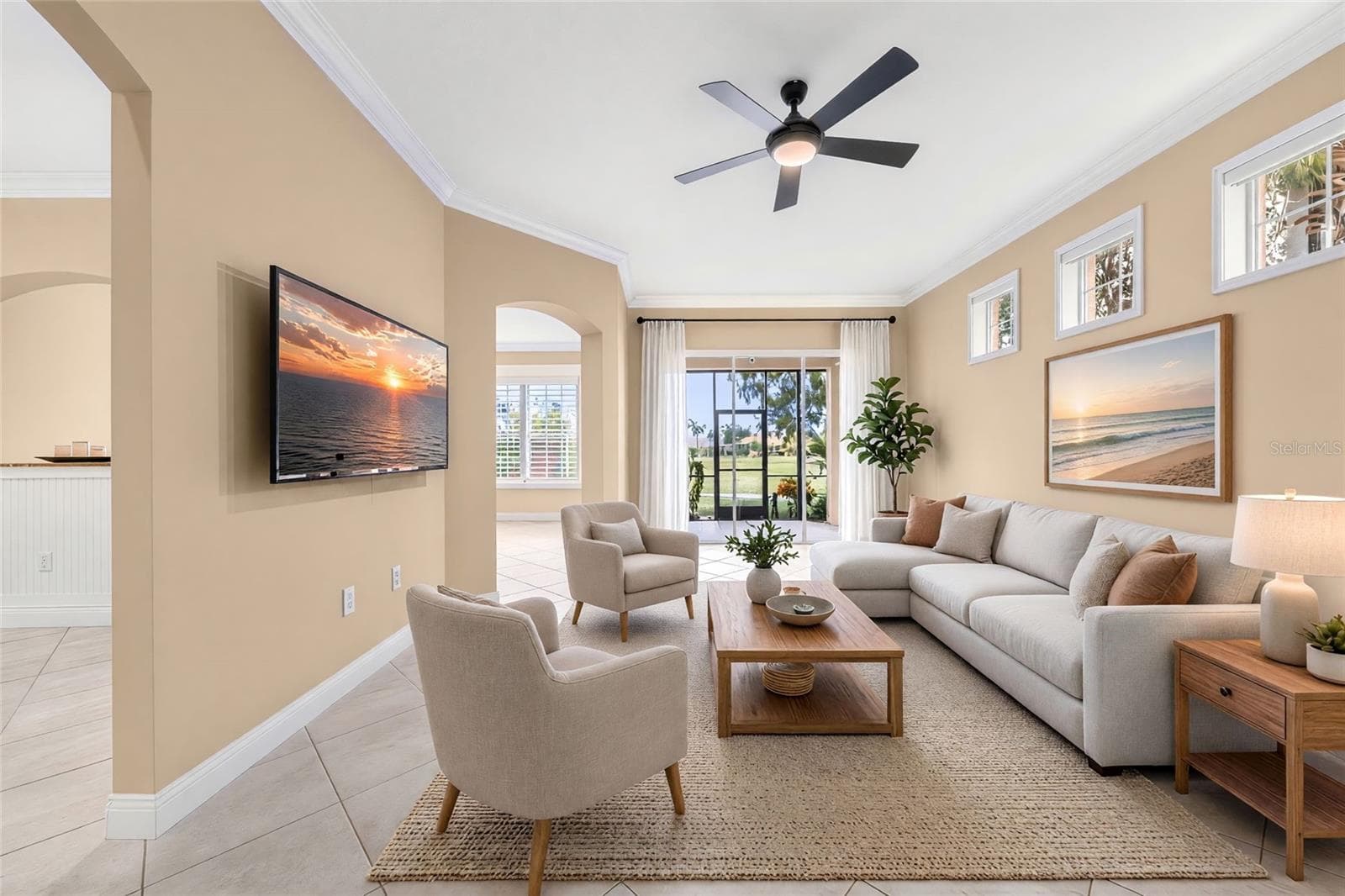 High ceilings and natural light create an inviting space to relax, with golf course views just beyond the sliders. - 8432 MIRAMAR WAY, LAKEWOOD RANCH
