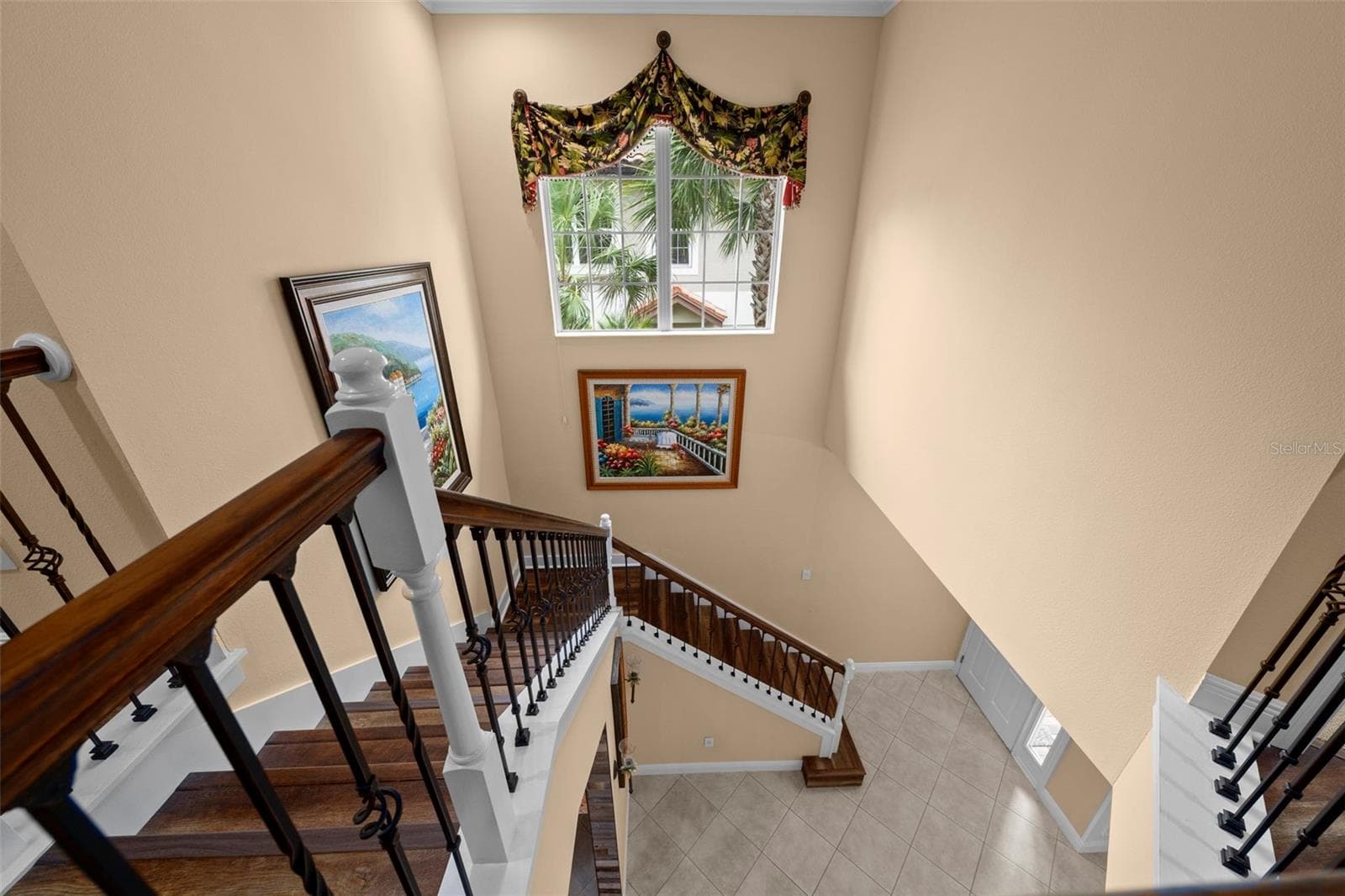 High ceilings and natural light create an open, airy feel between floors. - 8432 MIRAMAR WAY, LAKEWOOD RANCH