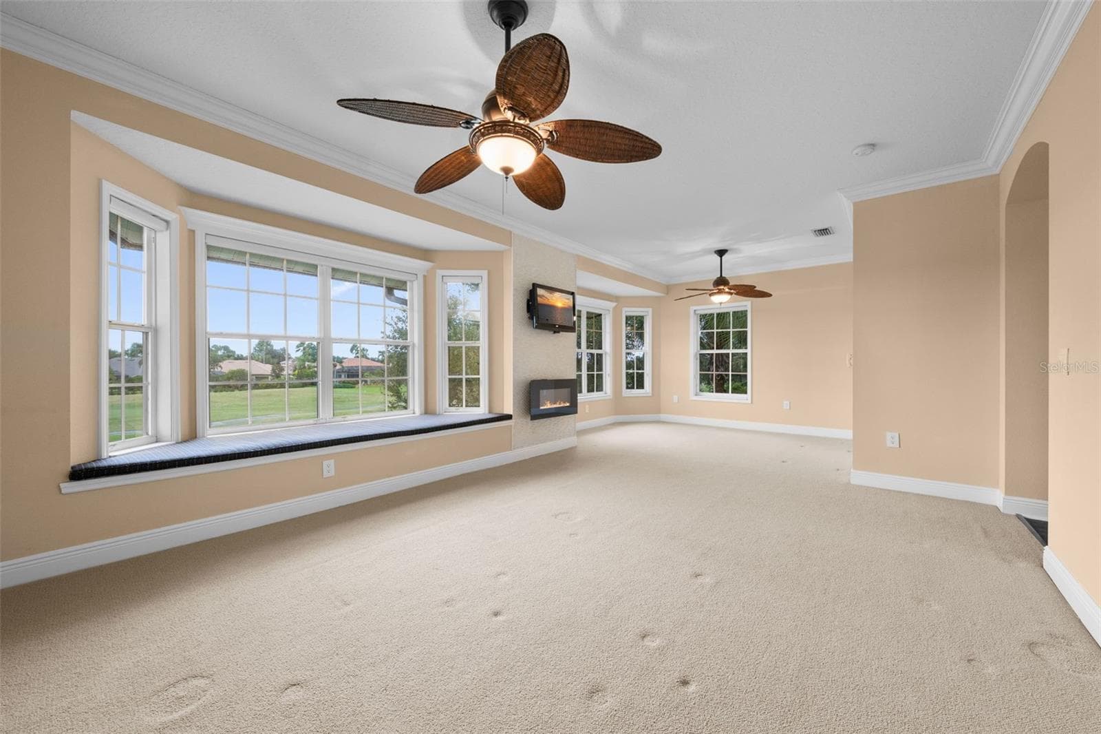 A spacious, light-filled retreat with expansive windows, a built-in window seat, and beautiful views. - 8432 MIRAMAR WAY, LAKEWOOD RANCH