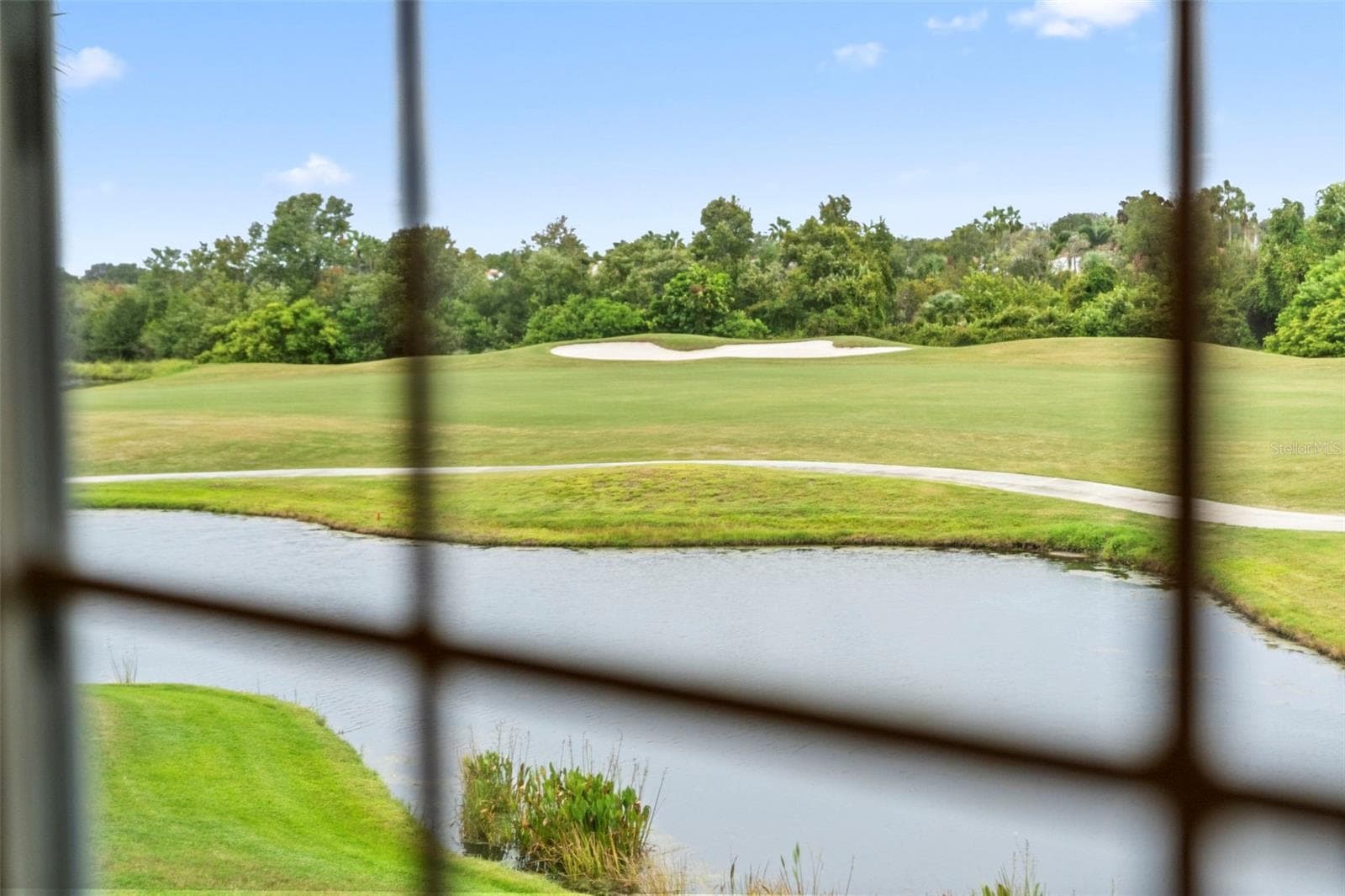 Peaceful water and sweeping fairway views make a beautiful start to the day. - 8432 MIRAMAR WAY, LAKEWOOD RANCH