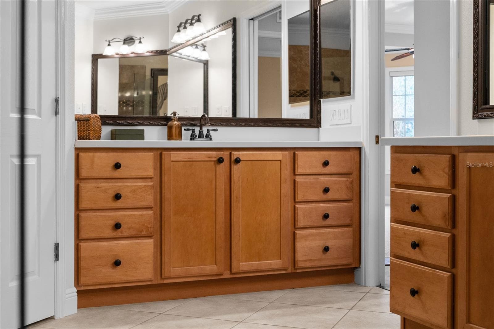 Separate vanities and abundant drawer space make sharing the primary bath easy. - 8432 MIRAMAR WAY, LAKEWOOD RANCH