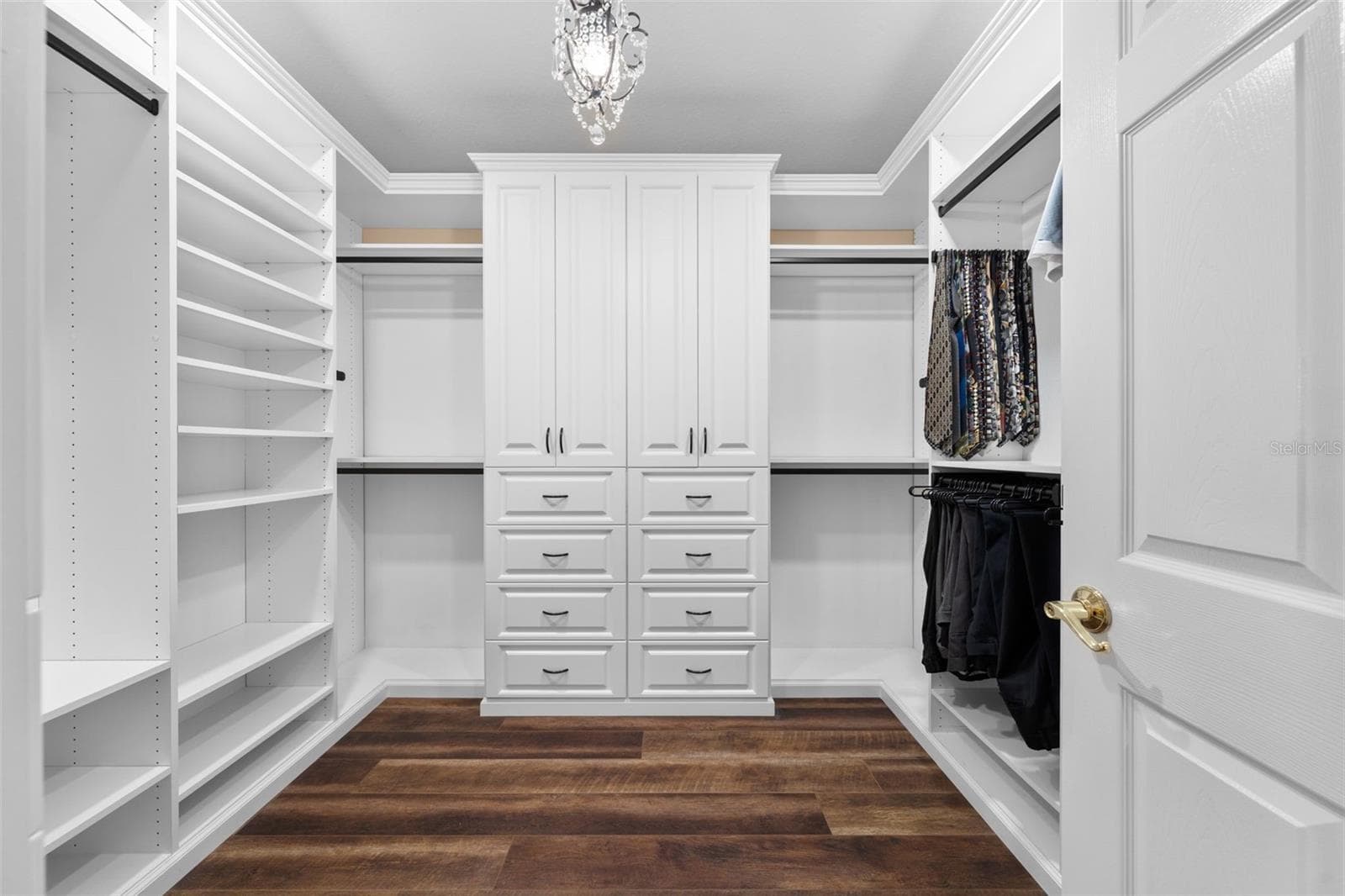 Keep everything organized with custom drawers, shelving, and generous hanging space in the walk-in closet. - 8432 MIRAMAR WAY, LAKEWOOD RANCH