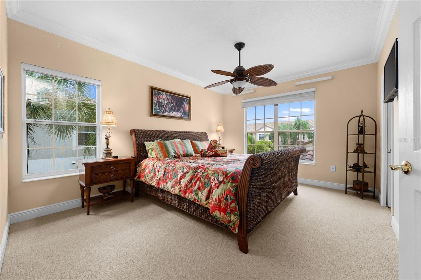 A bright, welcoming bedroom with plenty of natural light and room for overnight guests. - 8432 MIRAMAR WAY, LAKEWOOD RANCH