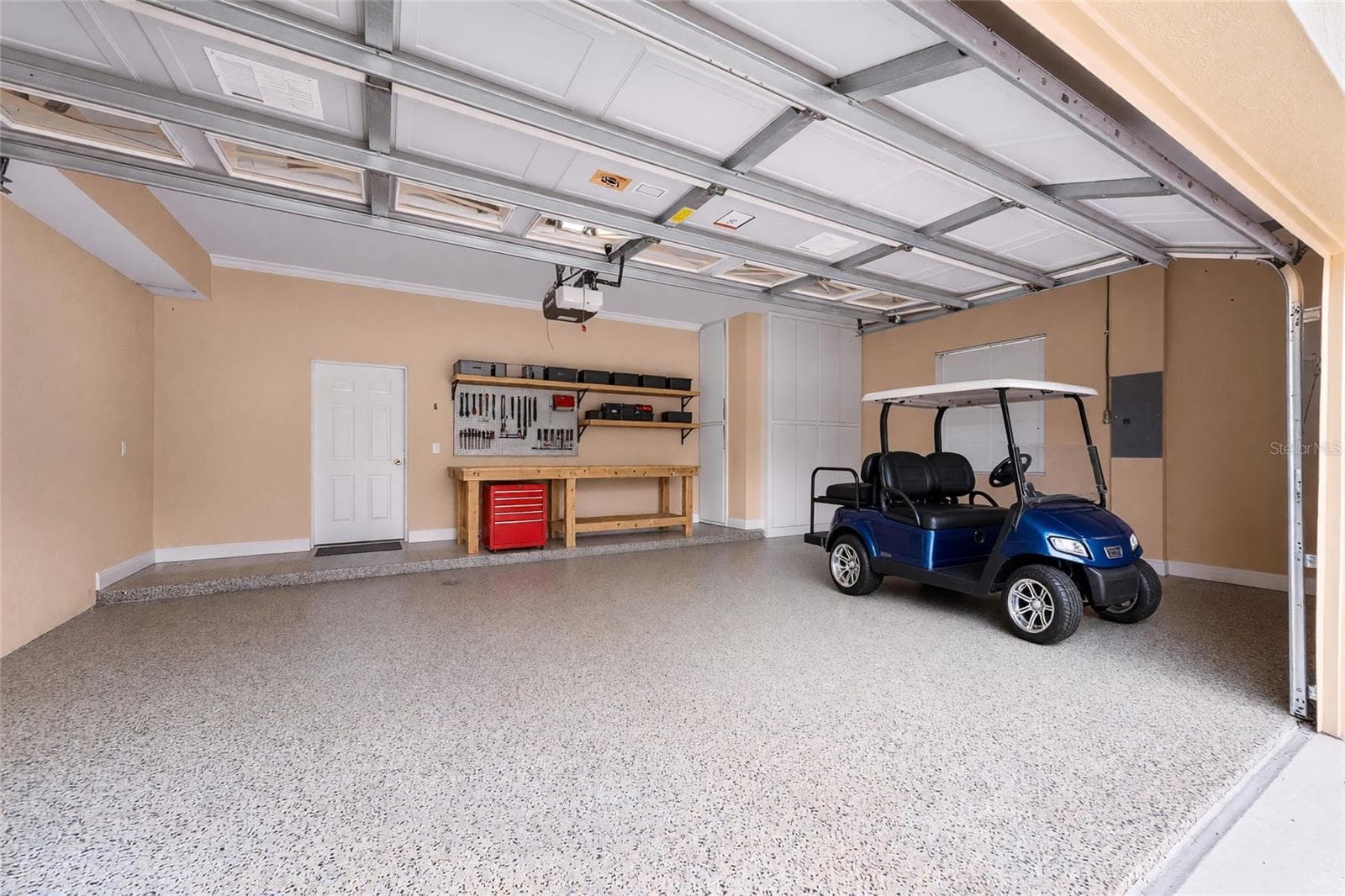 Extra built in custom storage and an epoxy-finished floor make this garage a standout feature. - 8432 MIRAMAR WAY, LAKEWOOD RANCH