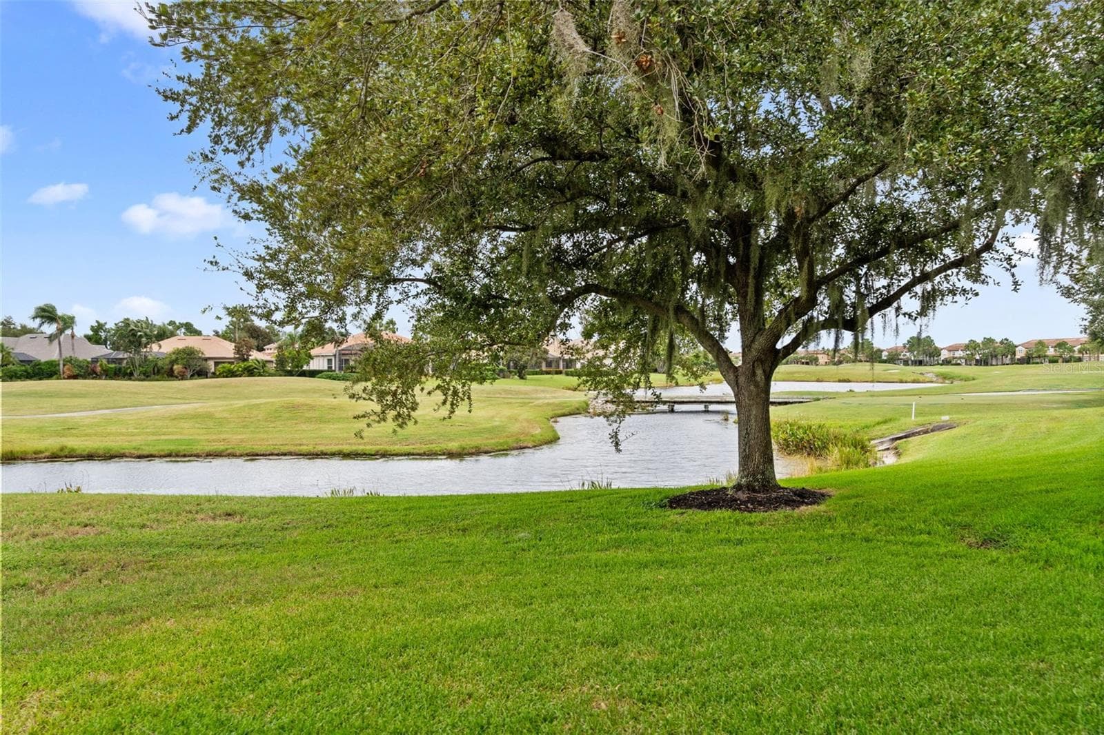 Peaceful lake views, open fairways, and mature trees make it easy to slow down and unwind. - 8432 MIRAMAR WAY, LAKEWOOD RANCH