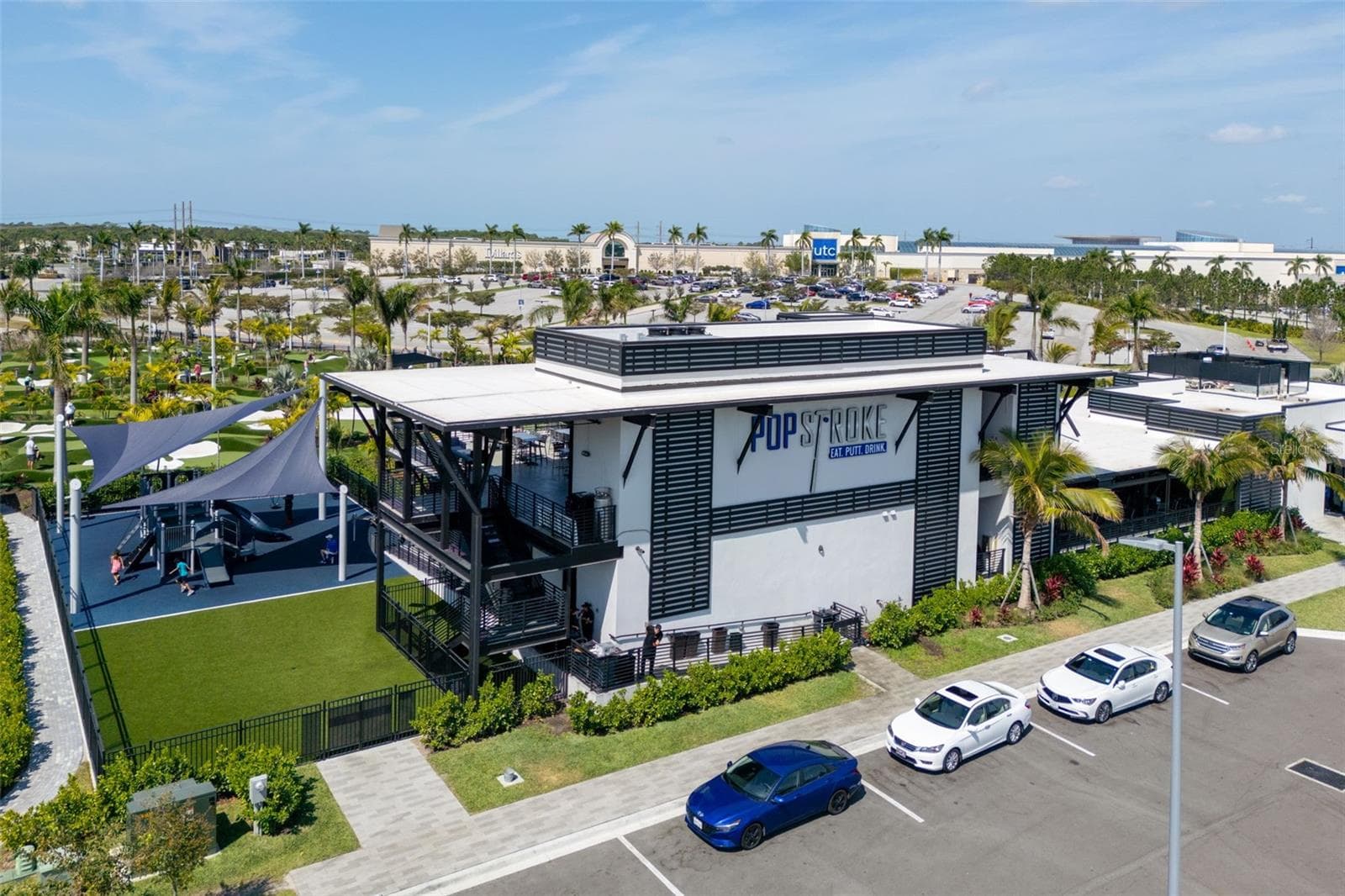 Enjoy a casual outing at nearby PopStroke, with putting greens and an inviting outdoor setting. - 8432 MIRAMAR WAY, LAKEWOOD RANCH