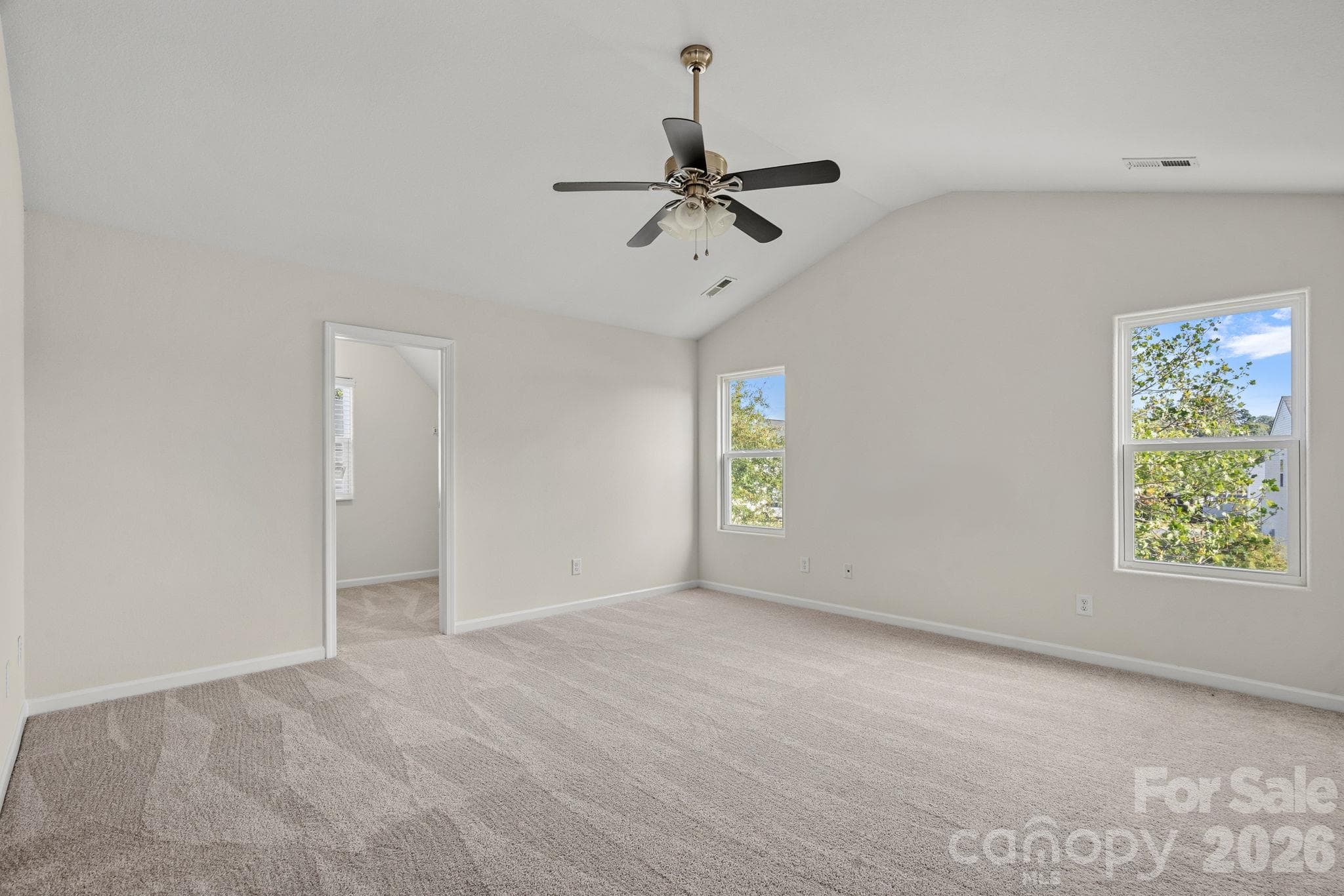 Primary bedroom with vaulted ceiling - without virtual staging - 6215 Paw Village Road, Charlotte
