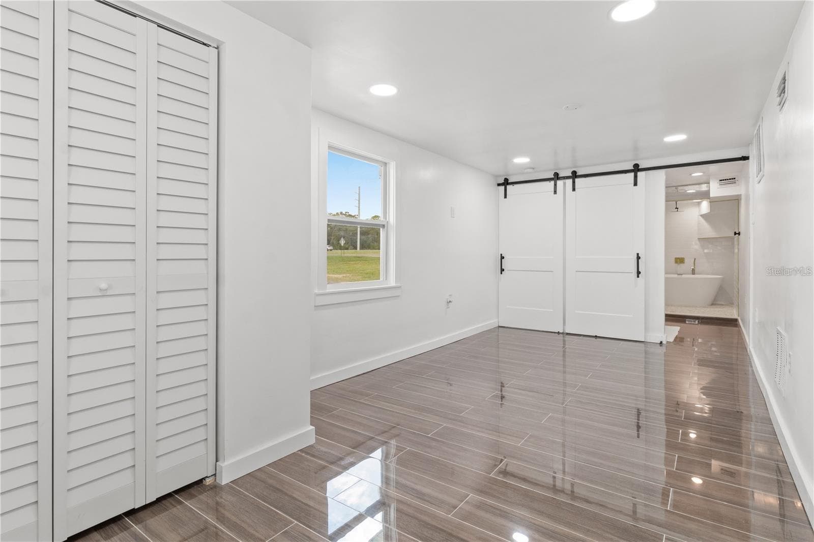 Second primary bedroom, bottom floor - 10908 LAND O LAKES BLVD, LAND O LAKES