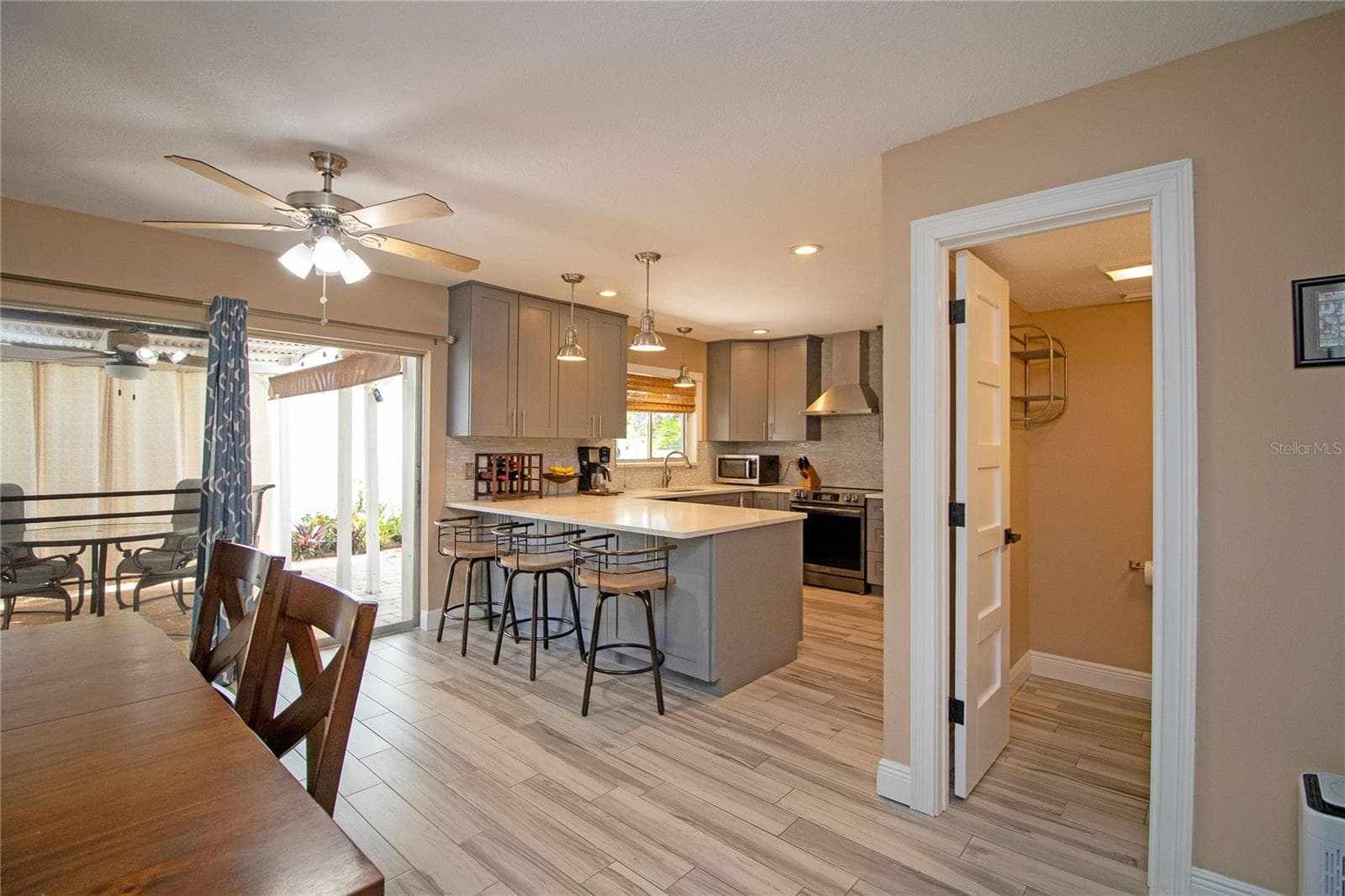 Dining area adjacent to kitchen and living room. - 1640 CAPE HOPE AVE NE #2, ST PETERSBURG