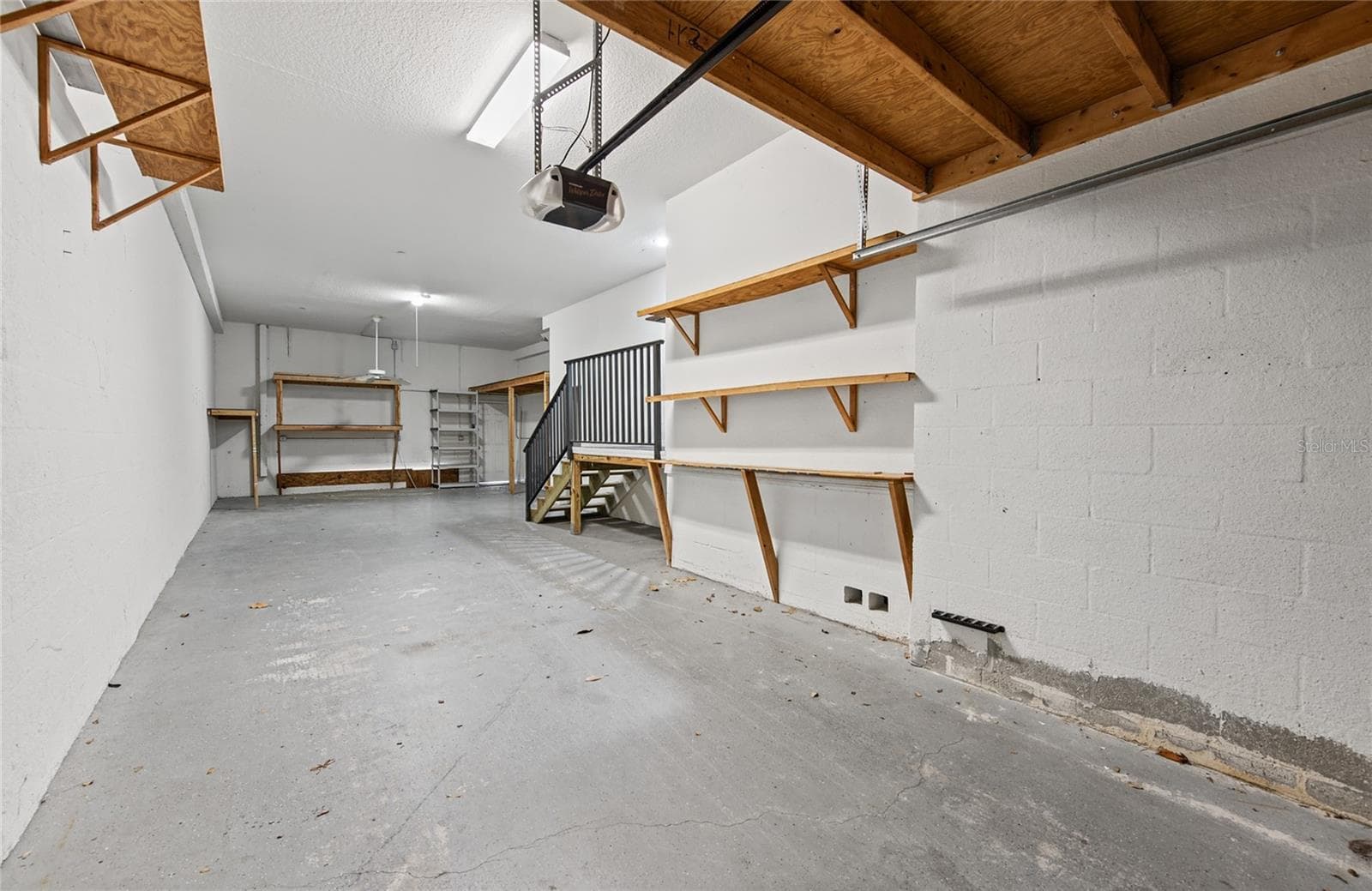 lots of built in storage in 3 car garage - 1146 VENETIAN HARBOR DR NE, ST PETERSBURG