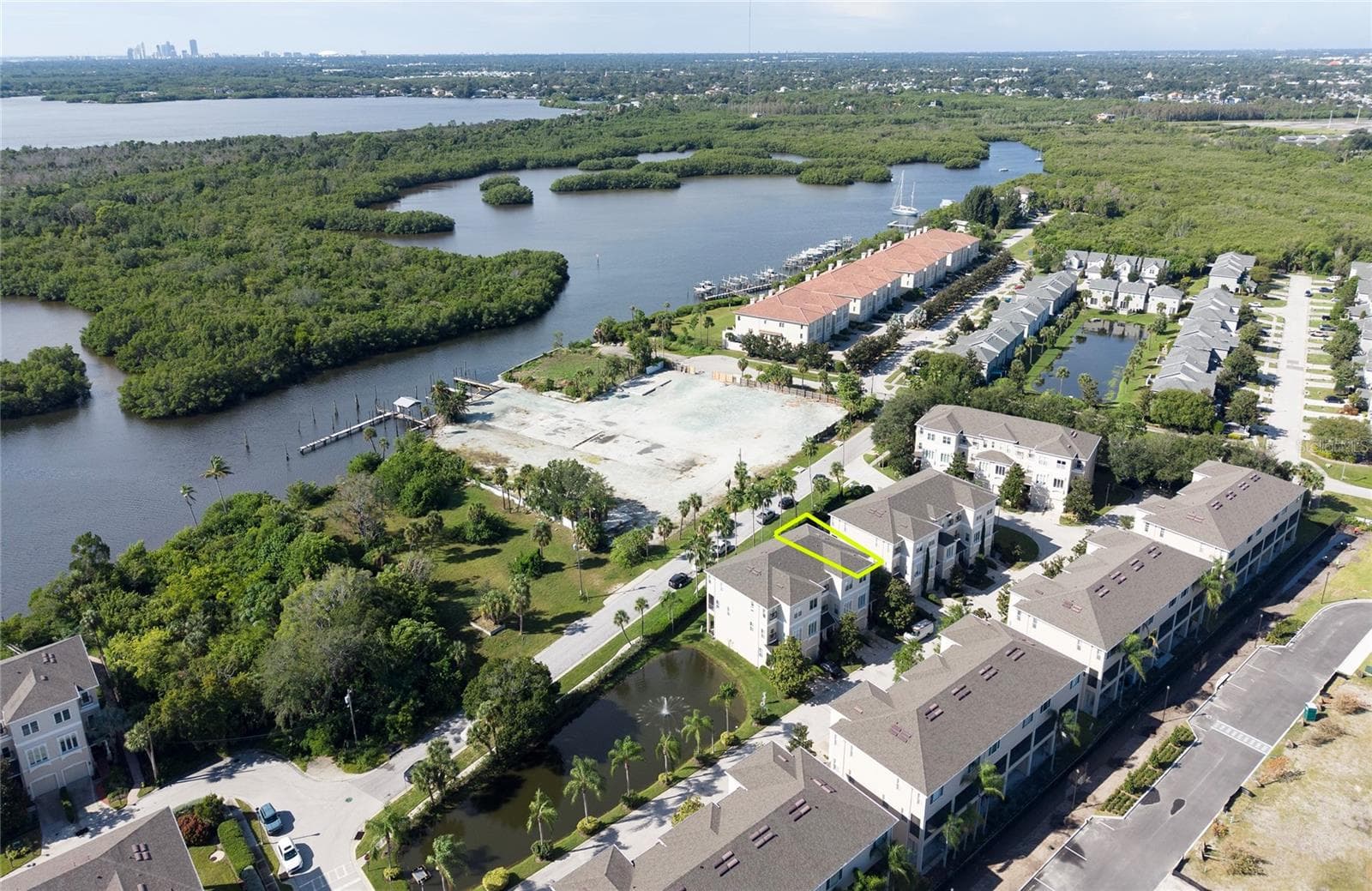 This corner townhome has a view of the water and Weedon Island. - 1146 VENETIAN HARBOR DR NE, ST PETERSBURG