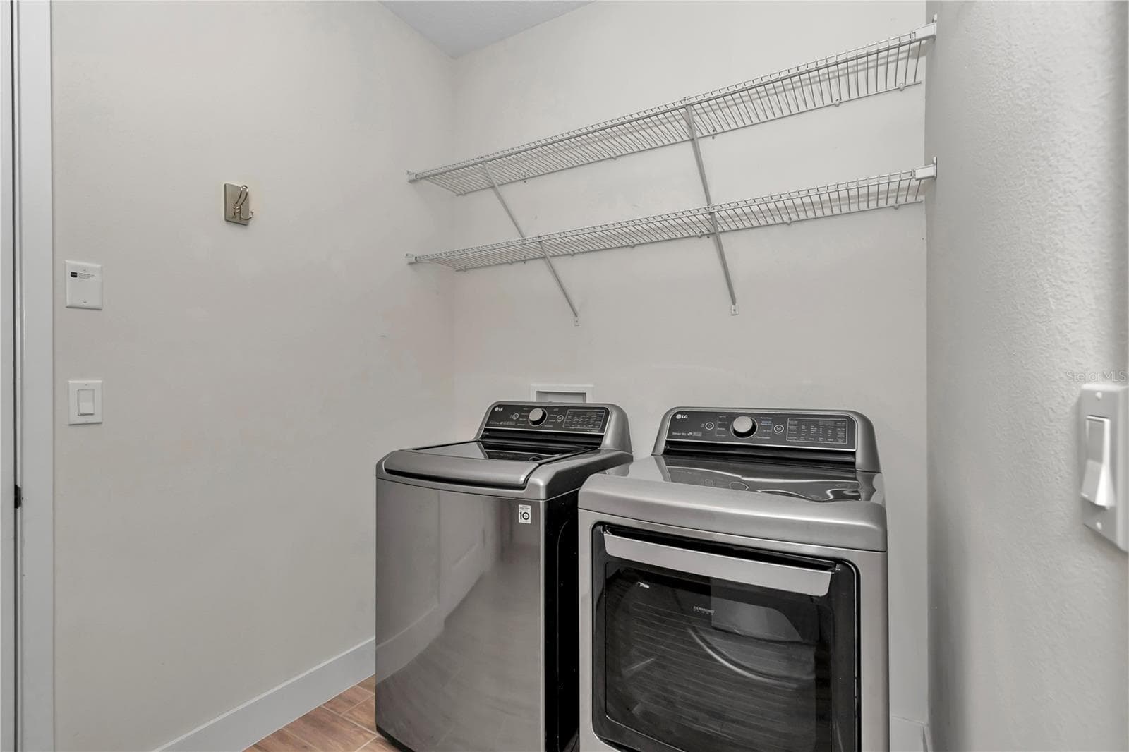 Extended laundry room with sink and storage - 4358 NW 57TH AVE, OCALA