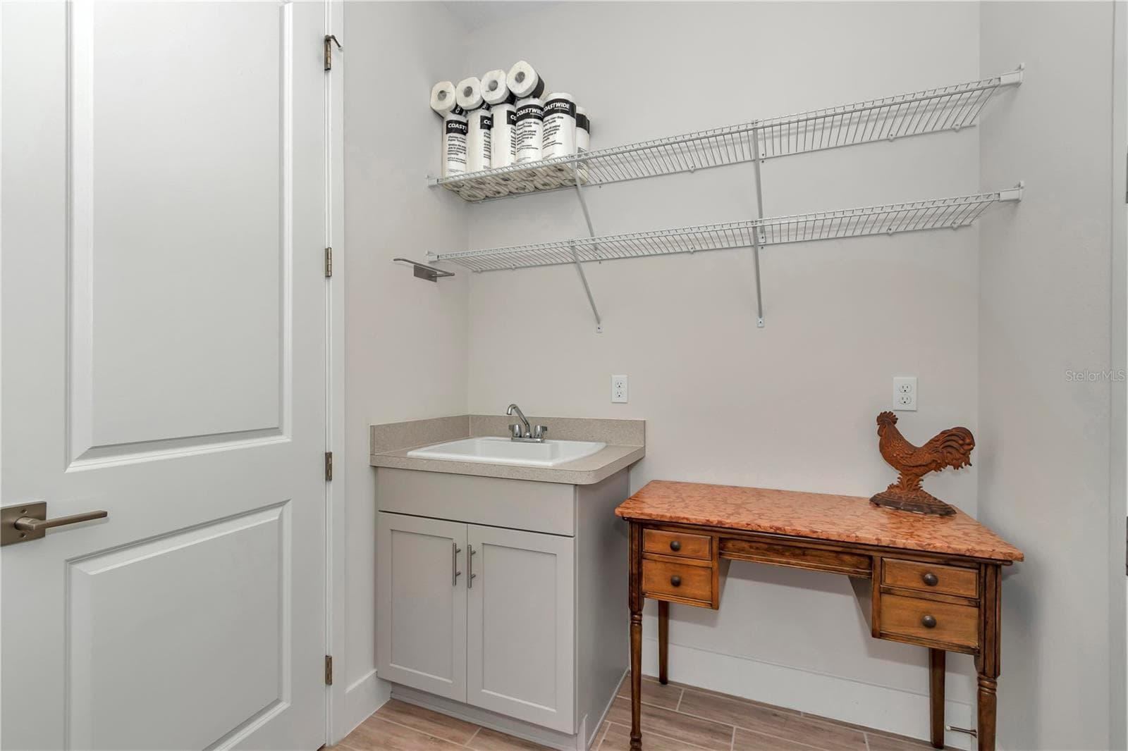 Extended Laundry room with sink and storage - 4358 NW 57TH AVE, OCALA