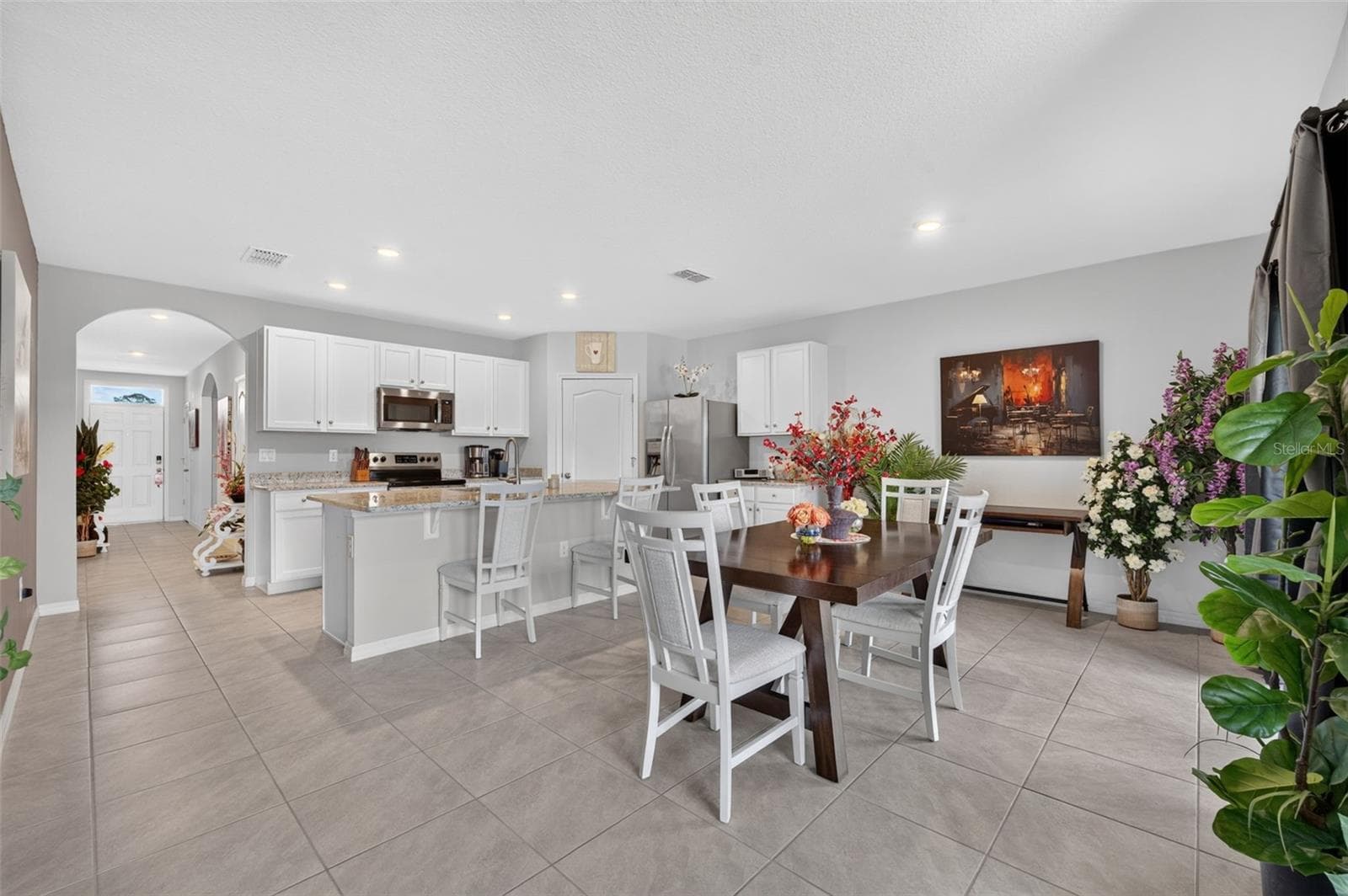 Open concept floor plan featuring a spacious kitchen and dining area. - 4367 LOOKING GLASS PL, SANFORD