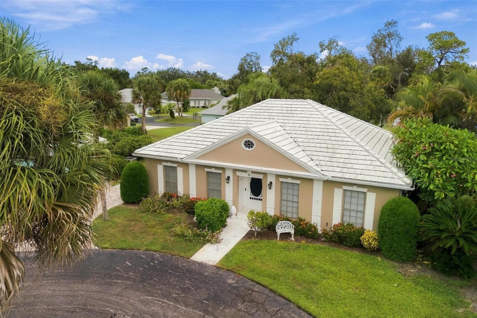 The tile roof completes the exterior charm of this home. - 4 ANTIGUA CIR #6, ENGLEWOOD