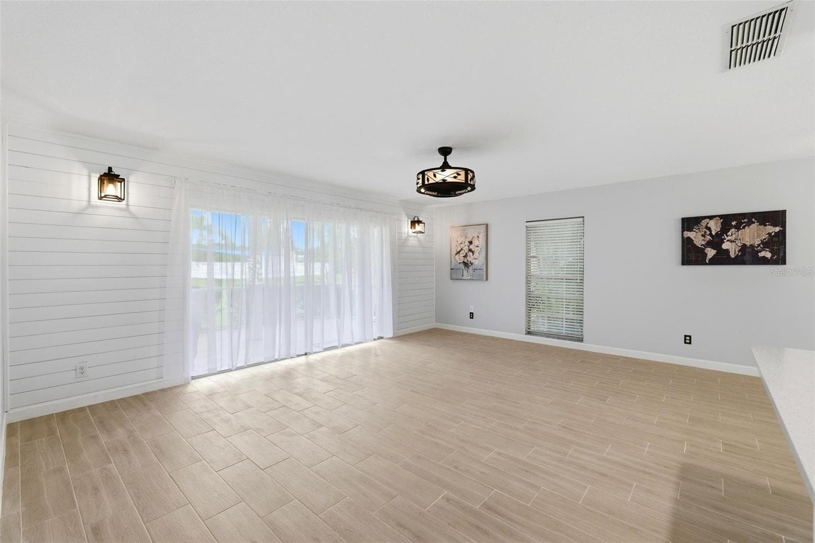 Full patio doors off the great room open onto spacious lanai - 4 ANTIGUA CIR #6, ENGLEWOOD