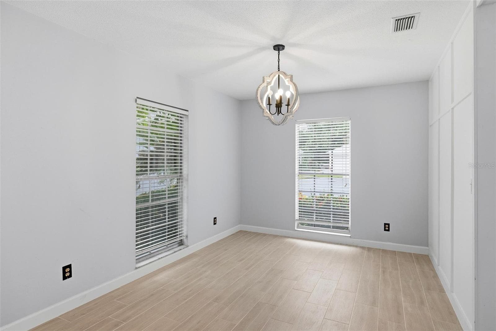 Another view of the dining room. Large, long windows lend lots of light to this bright and airy home! - 4 ANTIGUA CIR #6, ENGLEWOOD