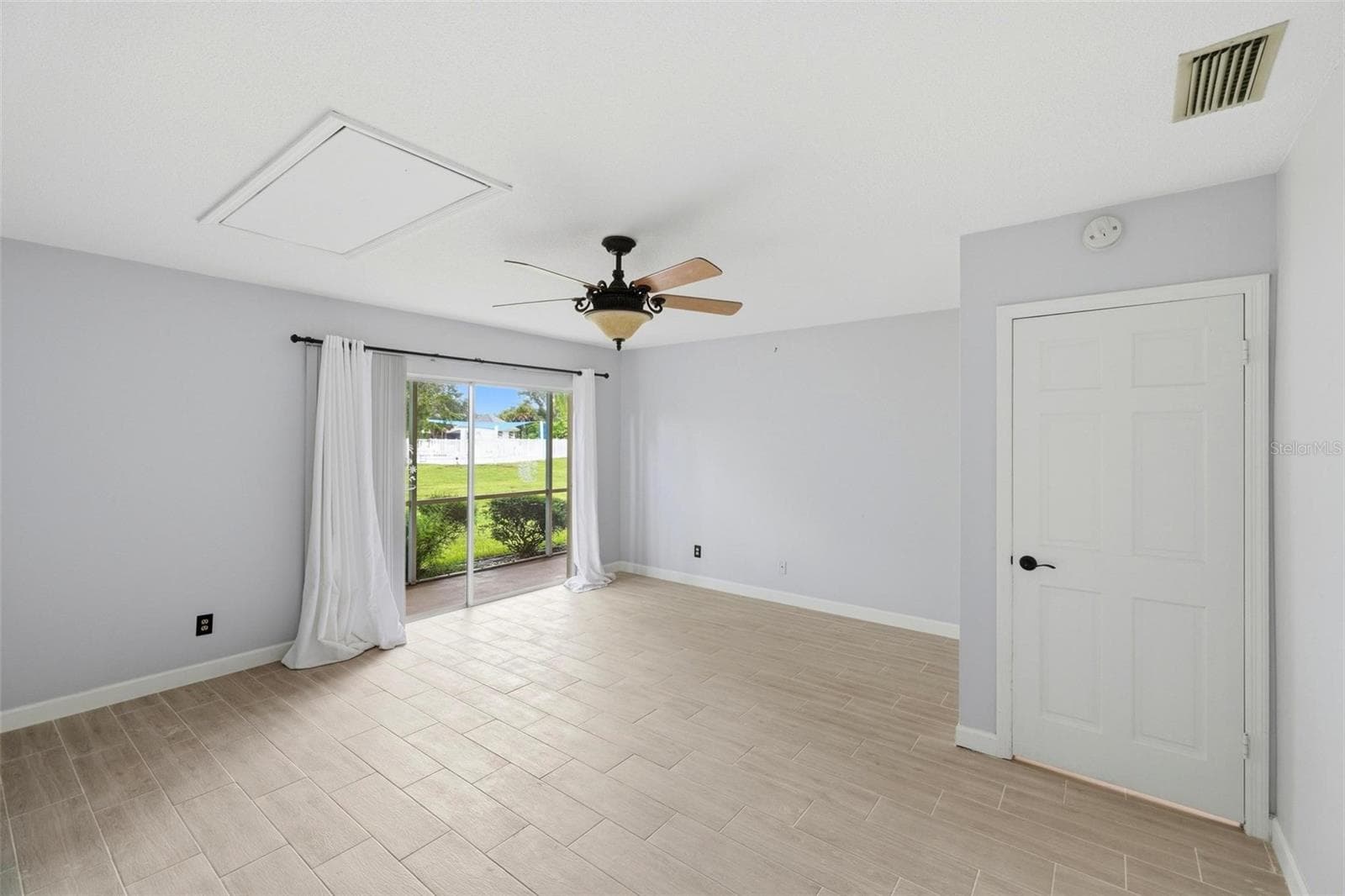 Large primary bedroom with patio doors onto lanai. - 4 ANTIGUA CIR #6, ENGLEWOOD