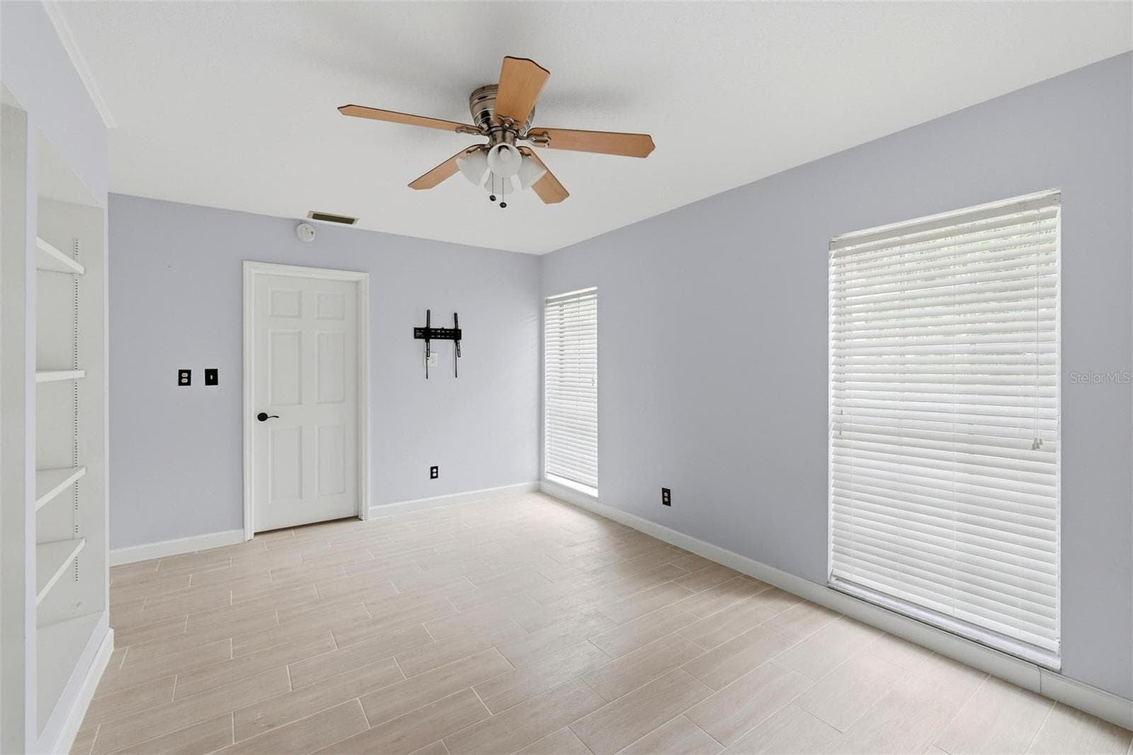 2nd bedroom bright and cheerful with two long, large windows full of natural light. Built shelving unit. - 4 ANTIGUA CIR #6, ENGLEWOOD
