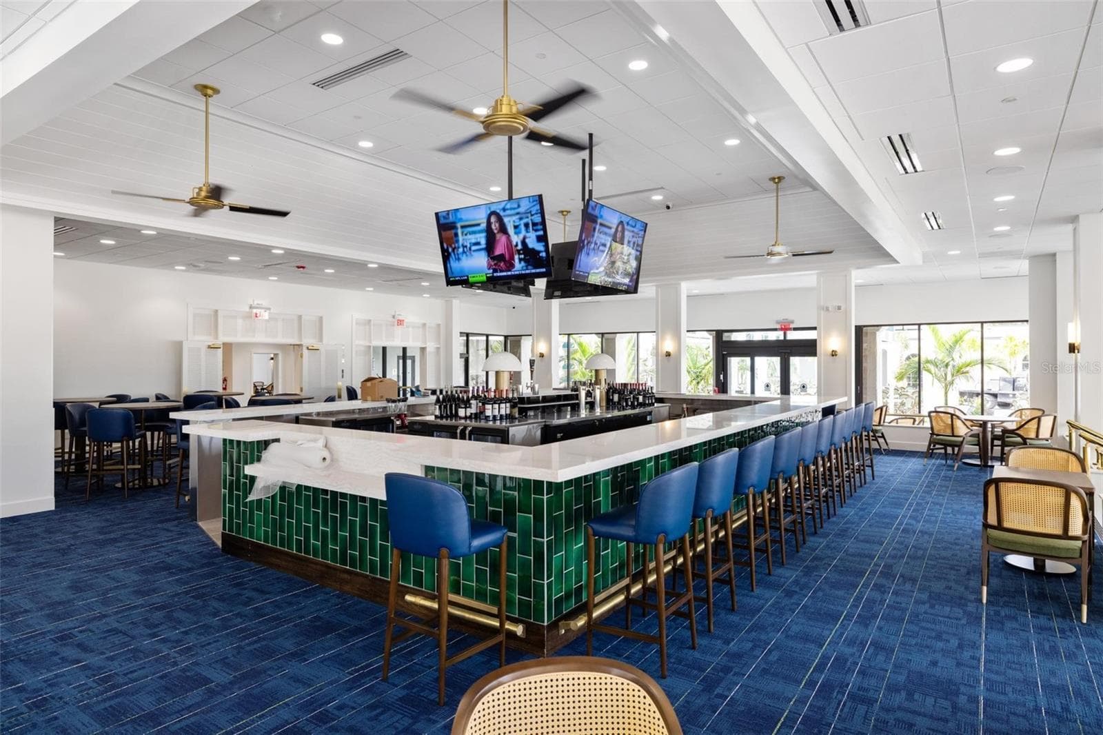 Interior of clubhouse with large bar area. Lots of windows overlooking golf course - 4 ANTIGUA CIR #6, ENGLEWOOD