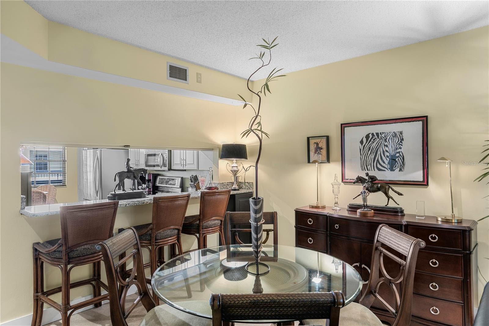 Kitchen flows effortlessly into bar seating and a dining area for a connected living experience - 1000 S HARBOUR ISLAND BLVD #2306, TAMPA