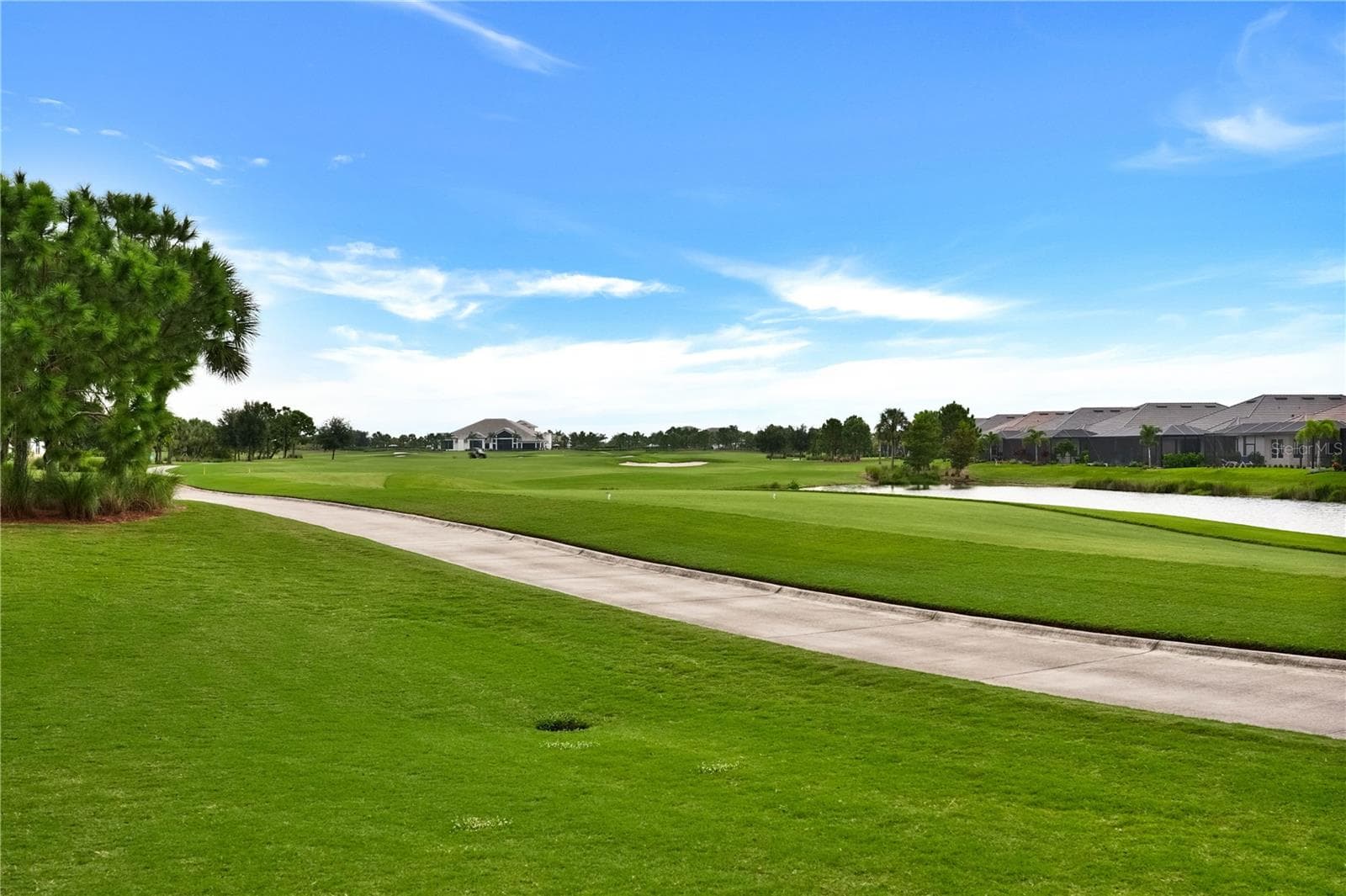 view of culinary center from backyard - 15281 CONTENTA LOOP, LAKEWOOD RANCH