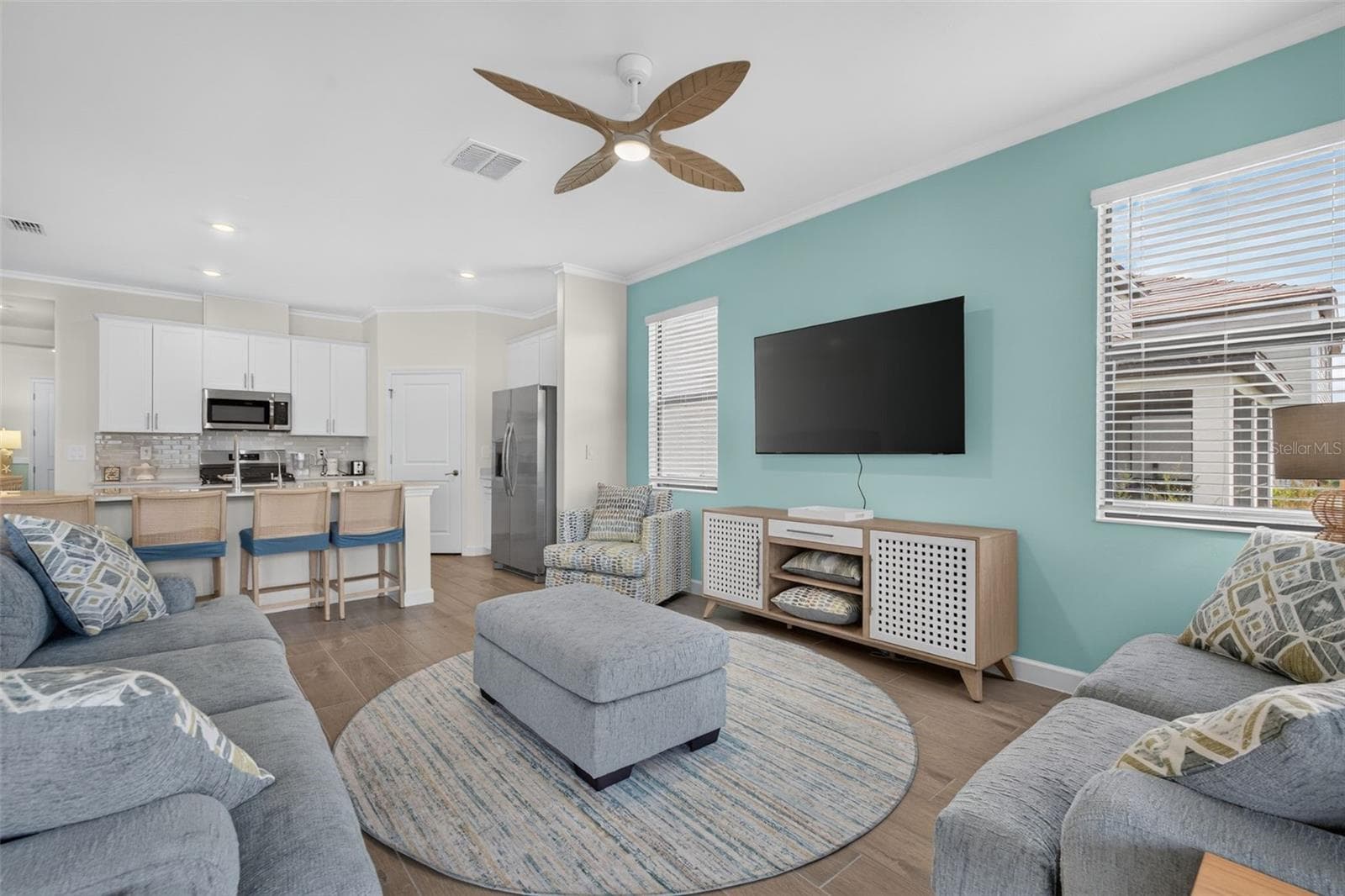 Living Room with large mounted T.V. - 15104 OXFORD GREY DR, BRADENTON